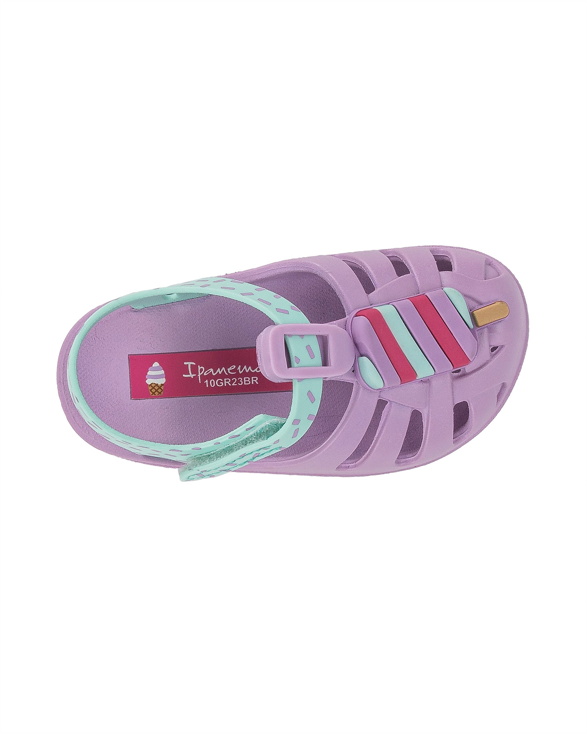 Top view of a purple and green Ipanema Summer baby fisherman sandal with popsicle on the upper.