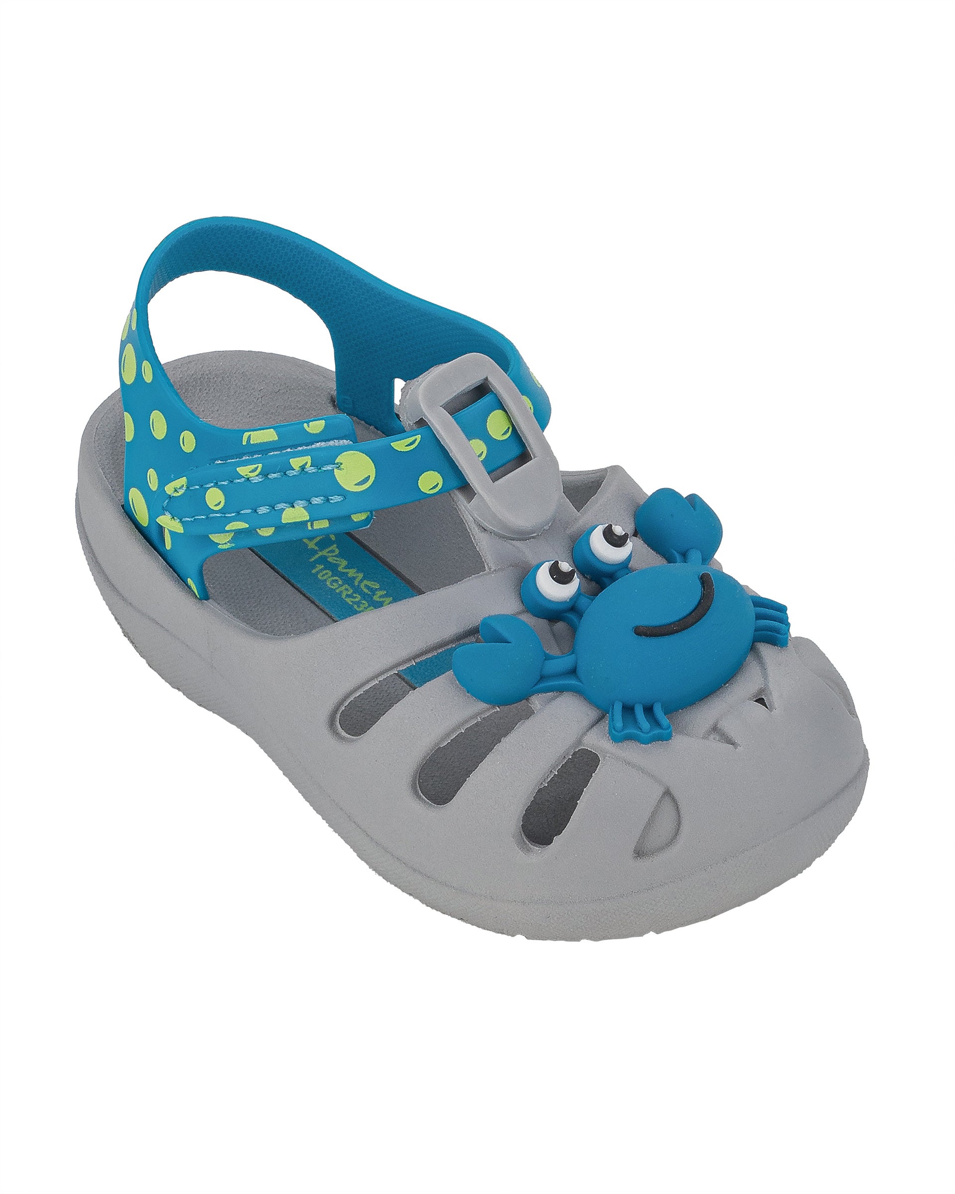 Angled view of a grey and blue Ipanema Summer baby fisherman sandal with blue crab on upper and green bubbles on a blue strap.