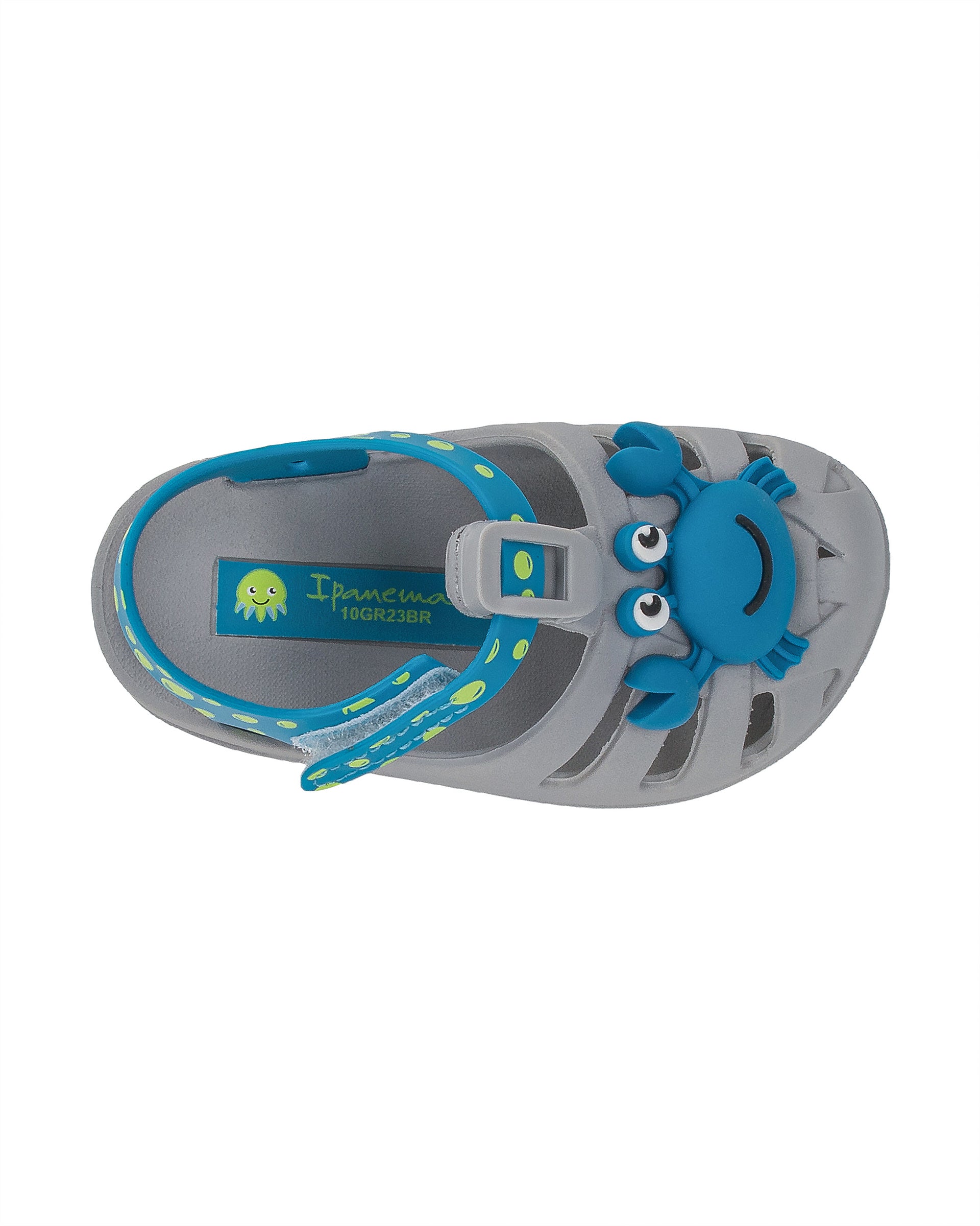 Top view of a grey and blue Ipanema Summer baby fisherman sandal with blue crab on upper and green bubbles on a blue strap.