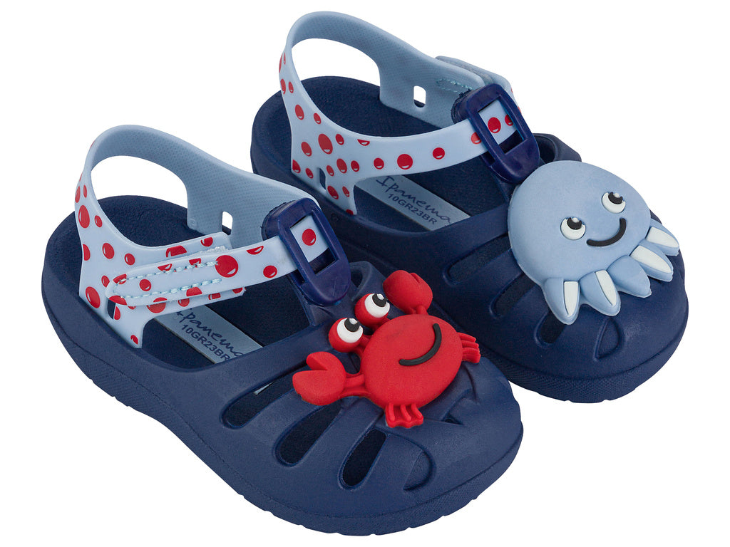 Angled view of a pair of blue/light blue Ipanema Summer baby fisherman sandal with red crab on one upper and a blue octopus on the other.