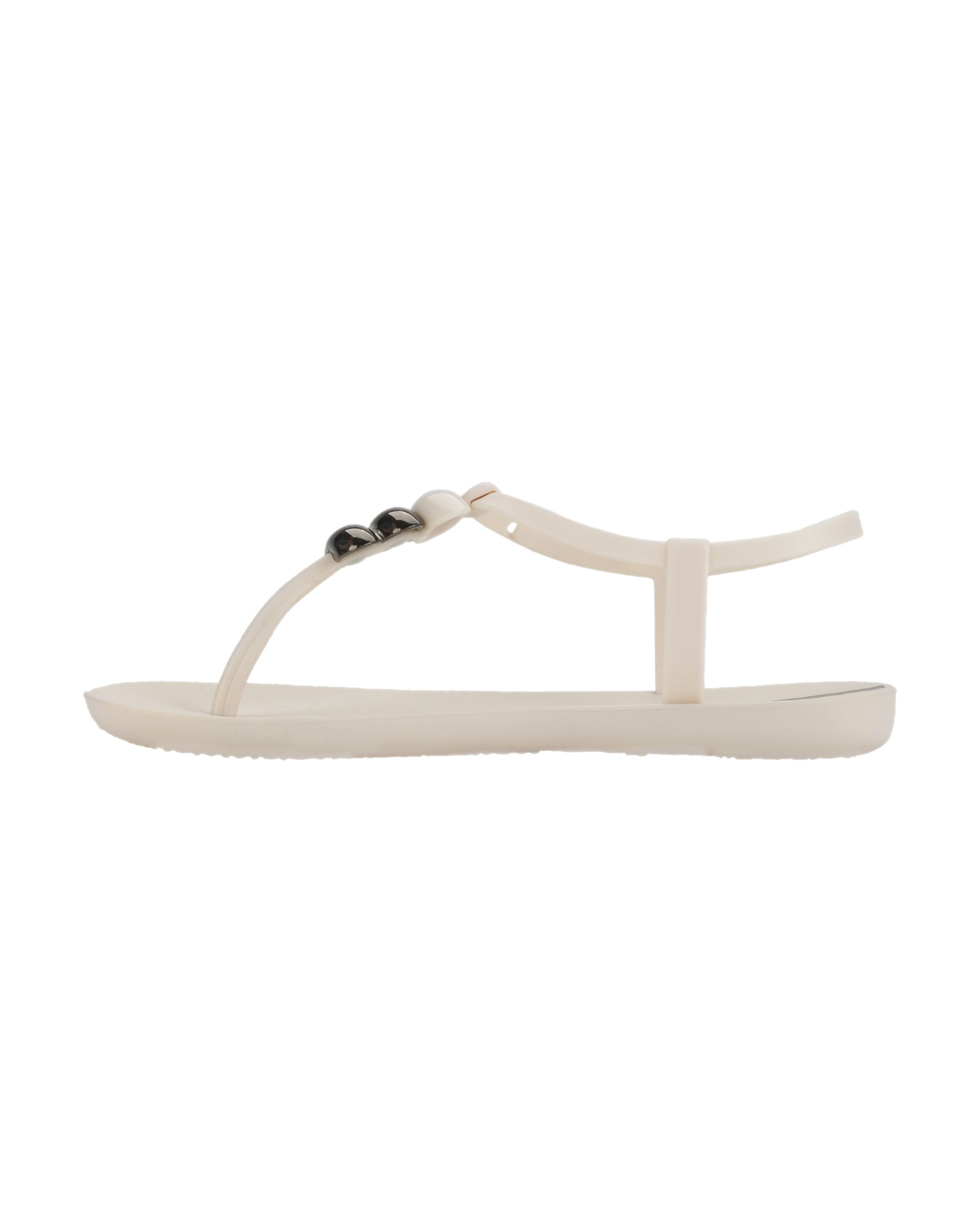 Inner side view of a beige Ipanema Class women's sandal with 3 bubble baubles on the t-strap.