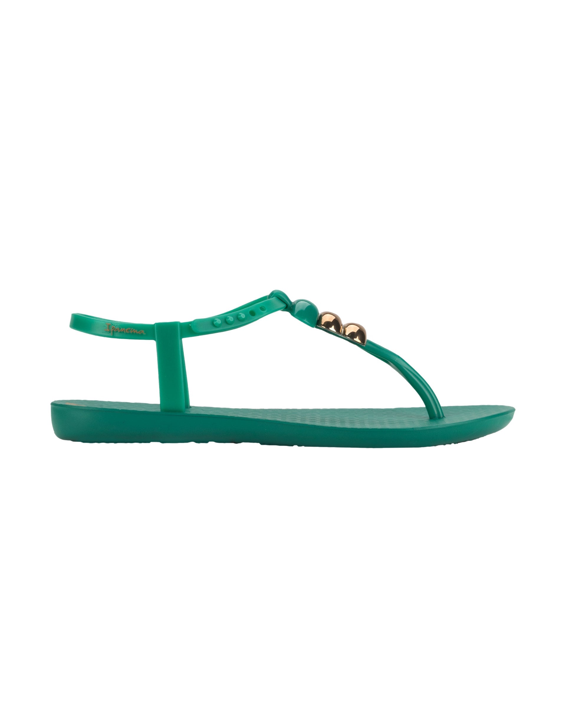 Outer side view of a green Ipanema Class women's sandal with 3 bubble baubles on the t-strap.