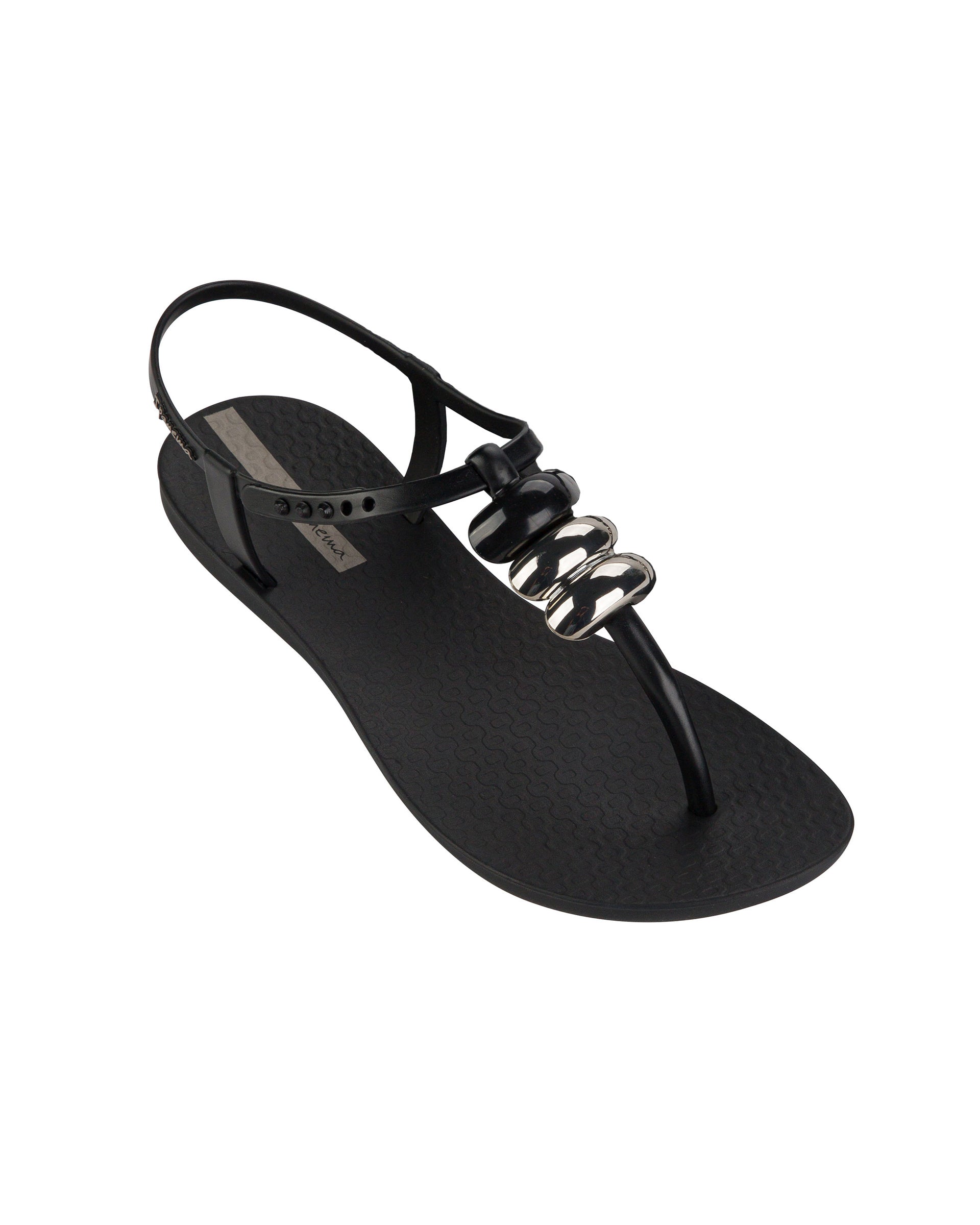 Angled view of a black Ipanema Class women's sandal with 3 bubble baubles on the t-strap.