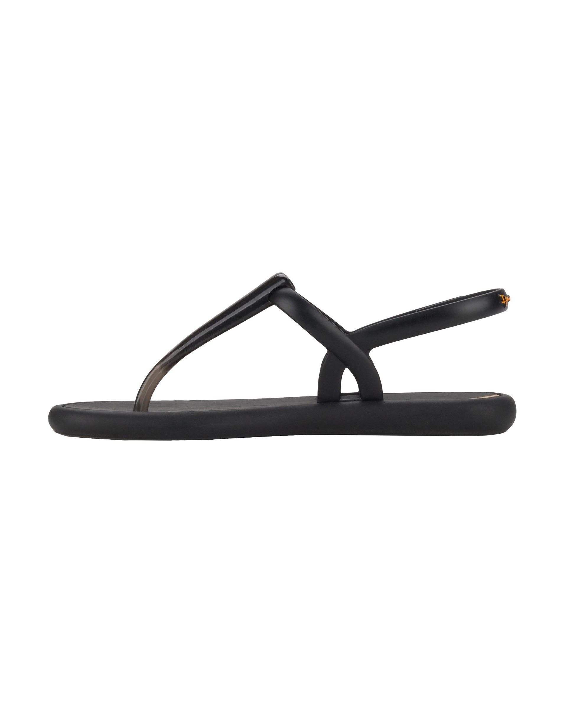Inner side view of a black Ipanema Glossy women's t-strap sandal.