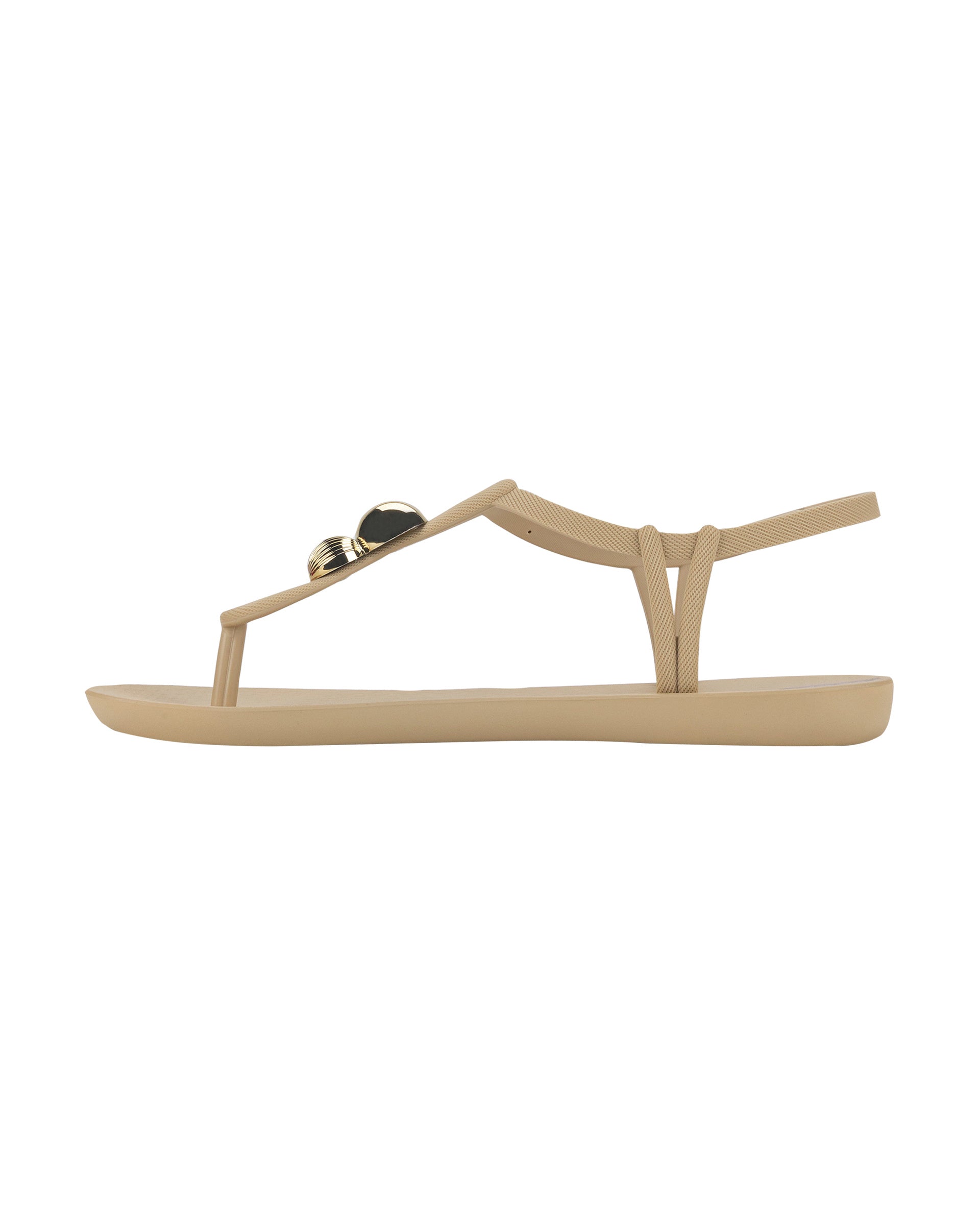 Inner side view of a beige Ipanema Class Spheres women's t-strap sandal with metallic bauble.