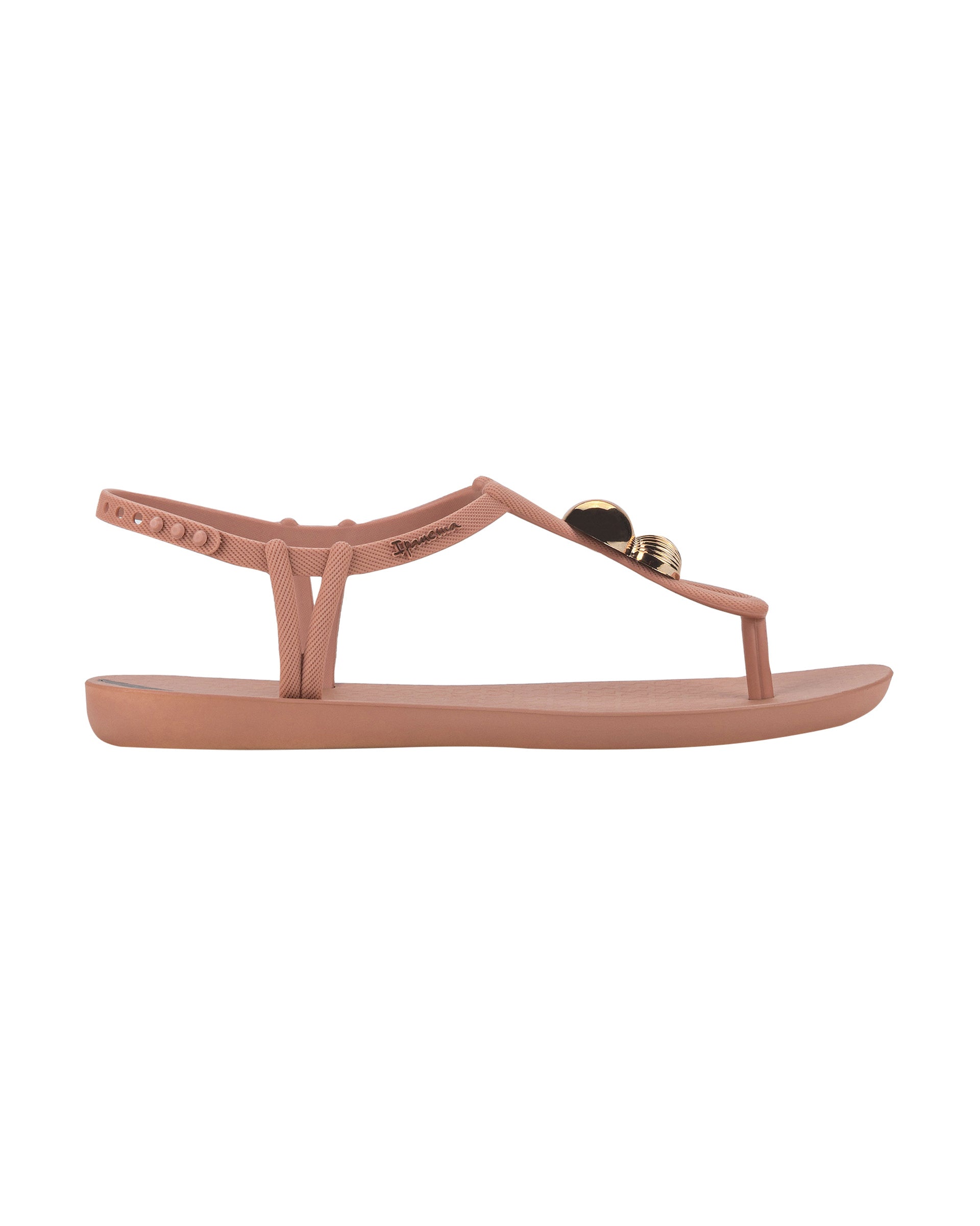 Outer side view of a light pink Ipanema Class Spheres women's t-strap sandal with metallic bauble.