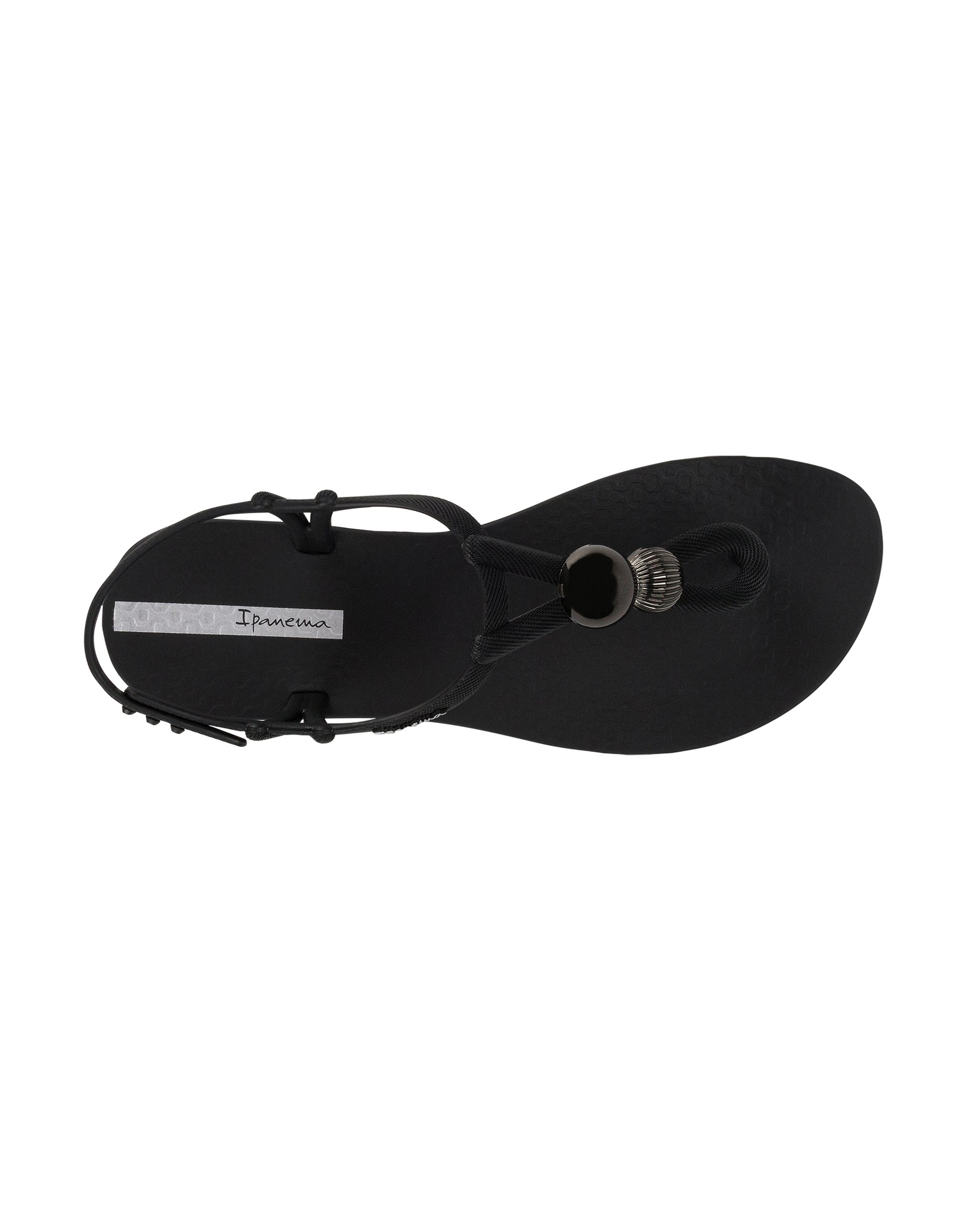 Top view of a black Ipanema Class Spheres women's t-strap sandal with metallic bauble.