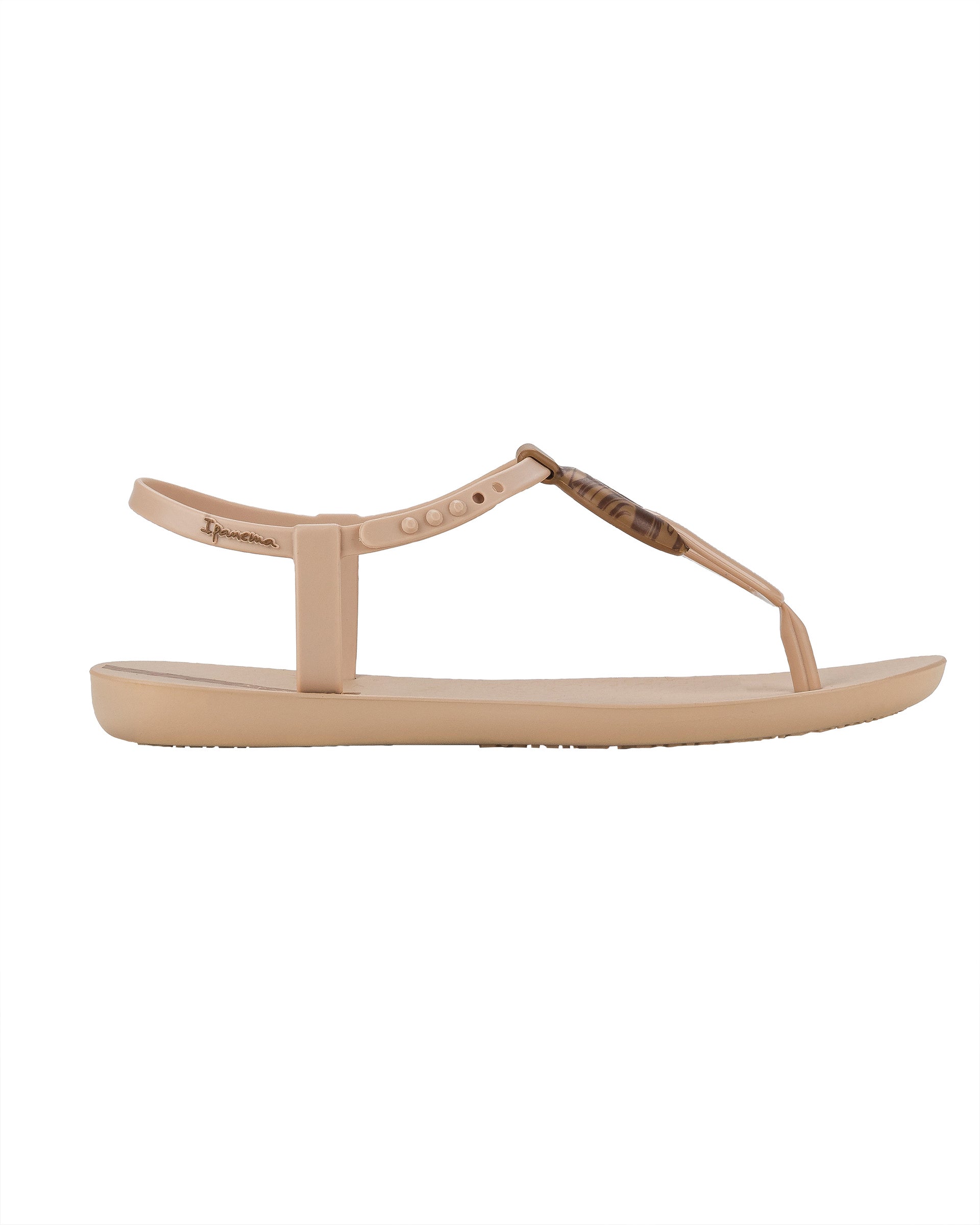 Outer side view of a beige Ipanema Class Marble women's t-strap sandal.