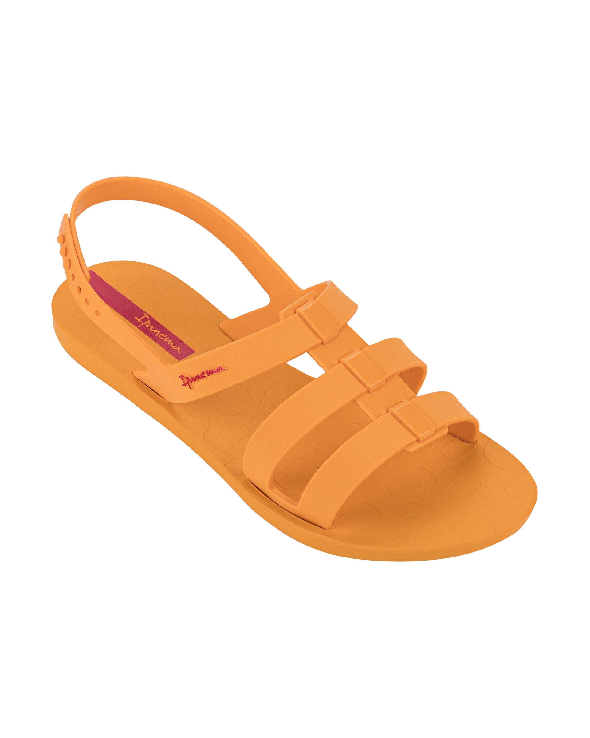 Angled view of a orange Ipanema Style women's sandal.