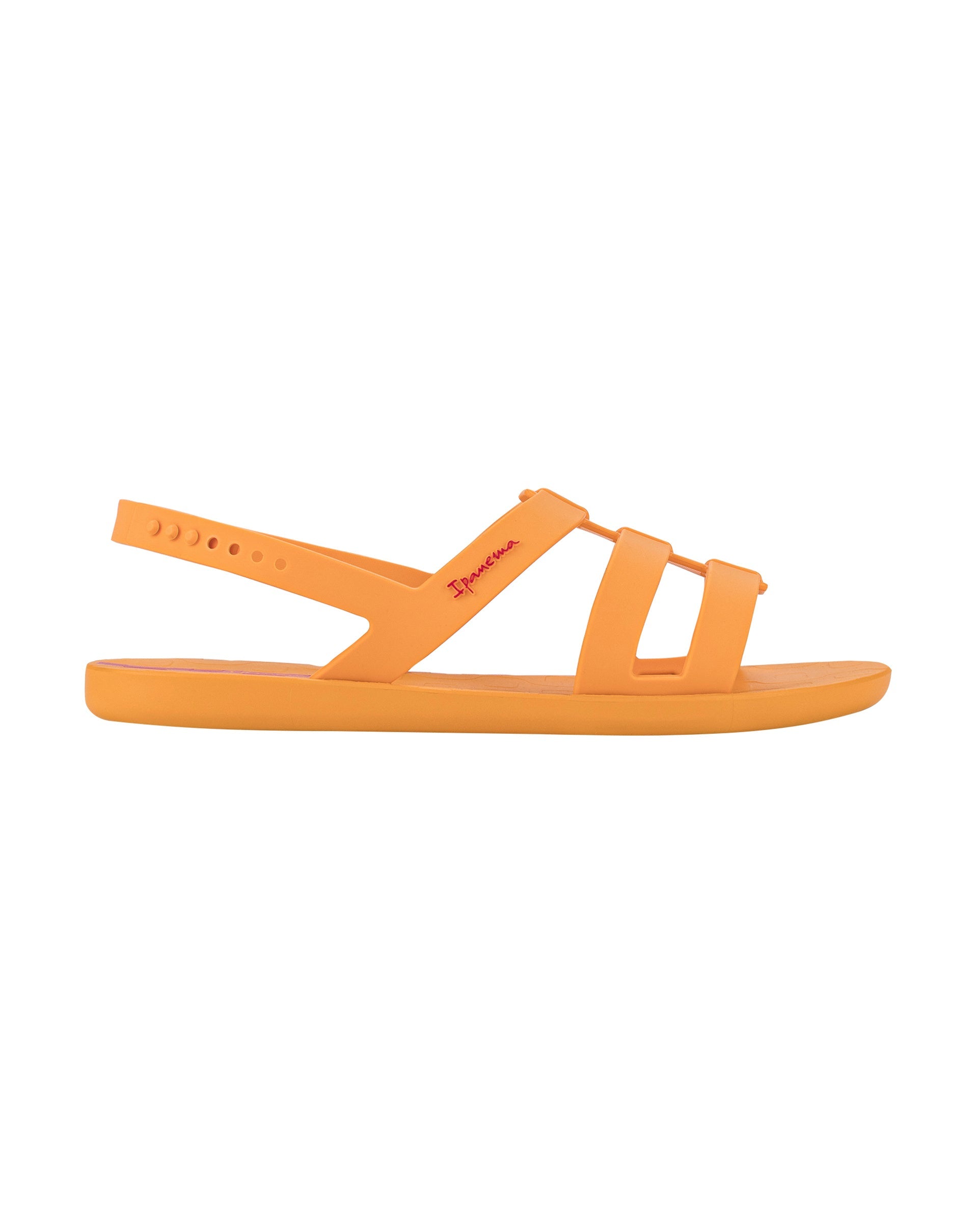 Outer side view of a orange Ipanema Style women's sandal.