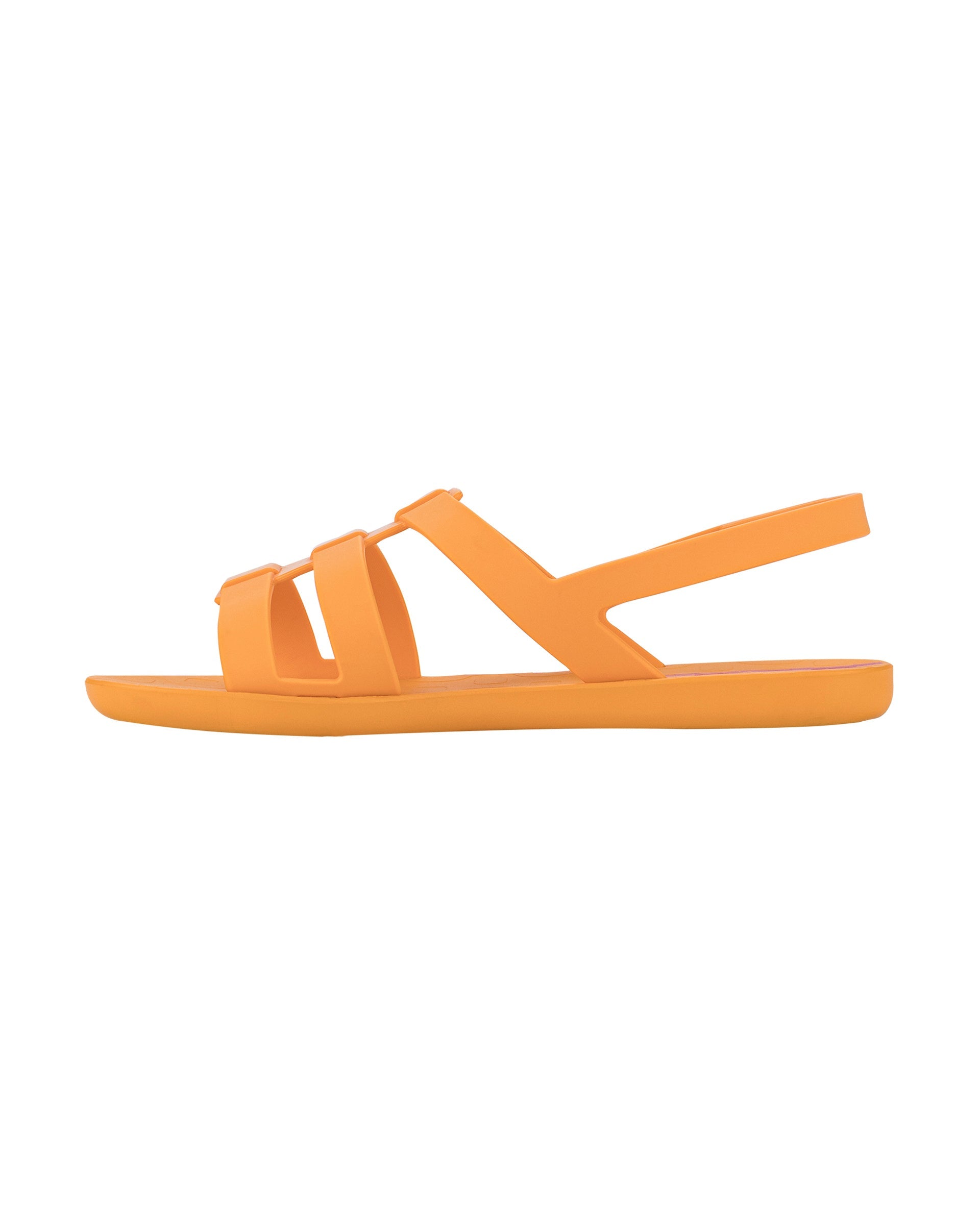 Inner side view of a orange Ipanema Style women's sandal.