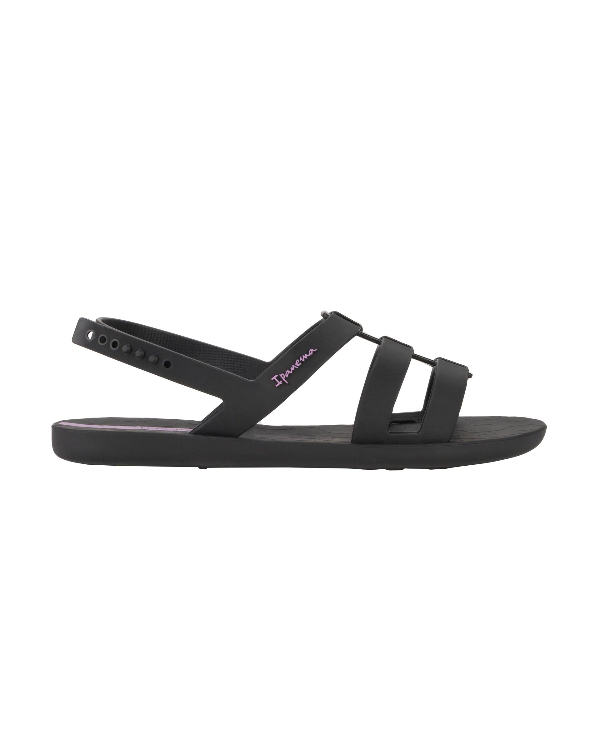 Outer side view of a black Ipanema Style women's sandal.