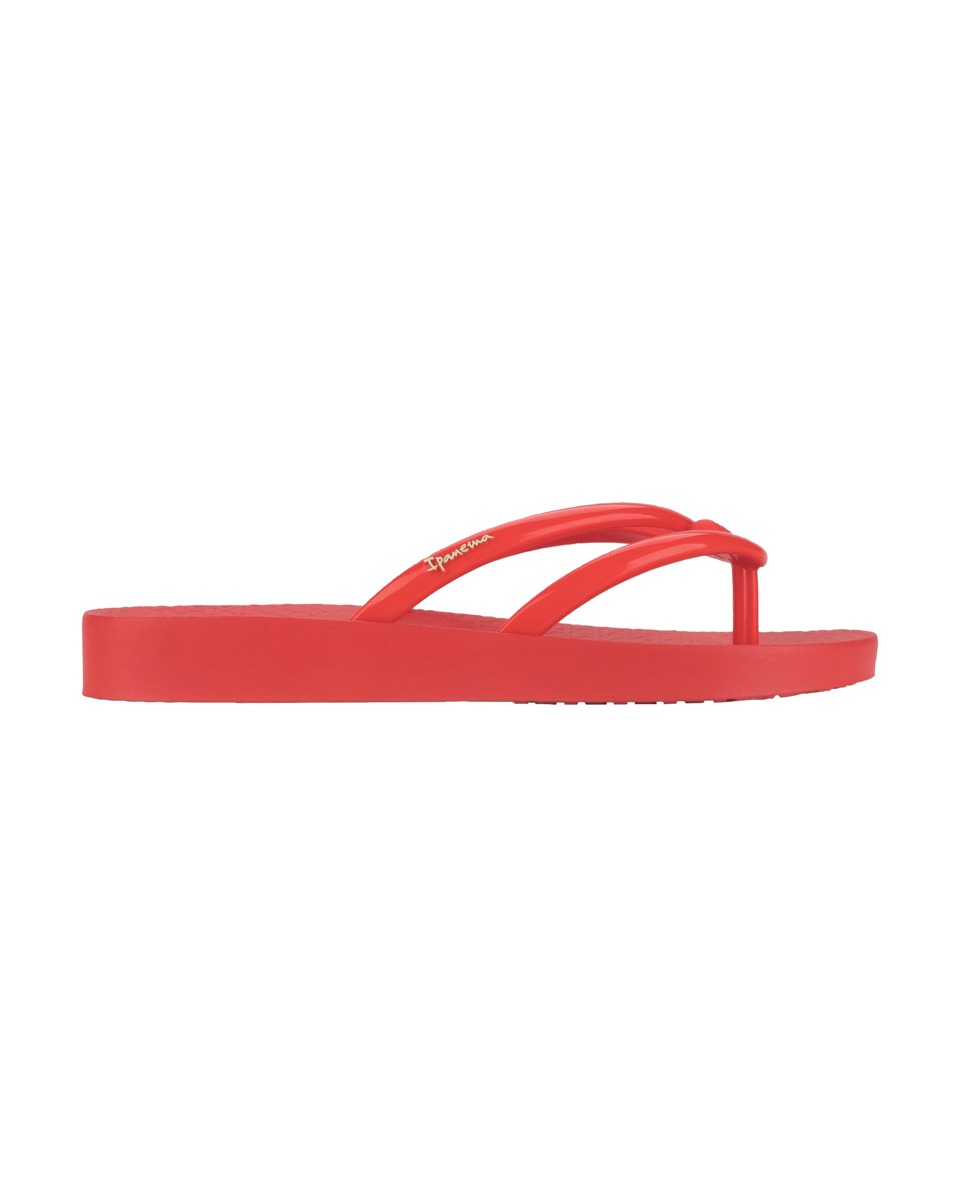 Outer side view of a red Ipanema Comfy women's flip flop.