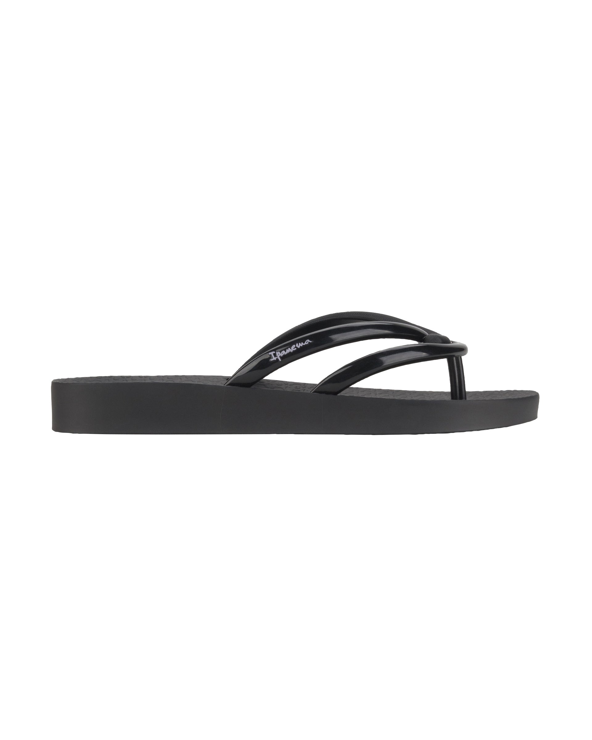 Outer side view of a black Ipanema Comfy women's flip flop.