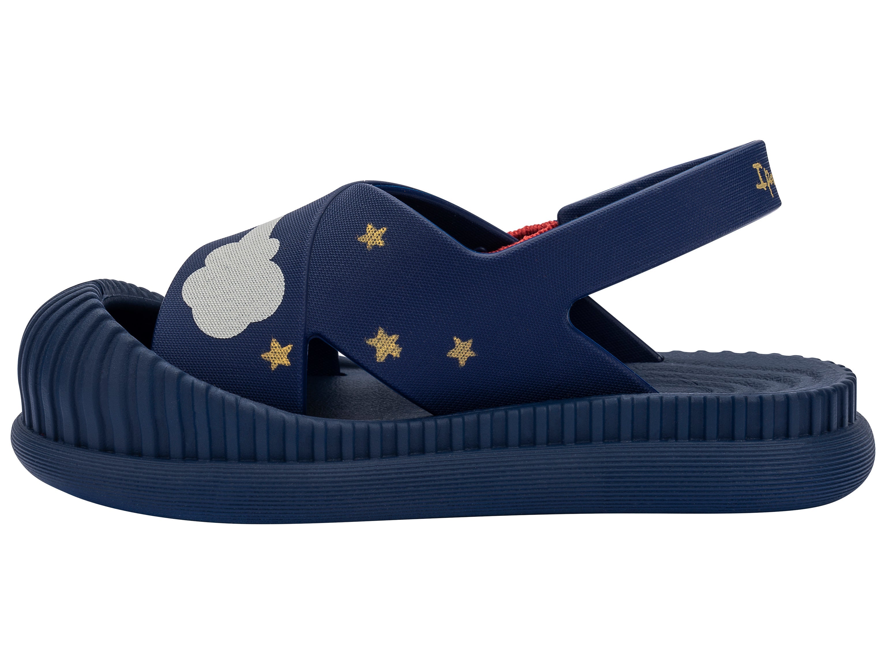 Inner side view of a blue Ipanema Cute baby sandal with rocket ship on the strap.