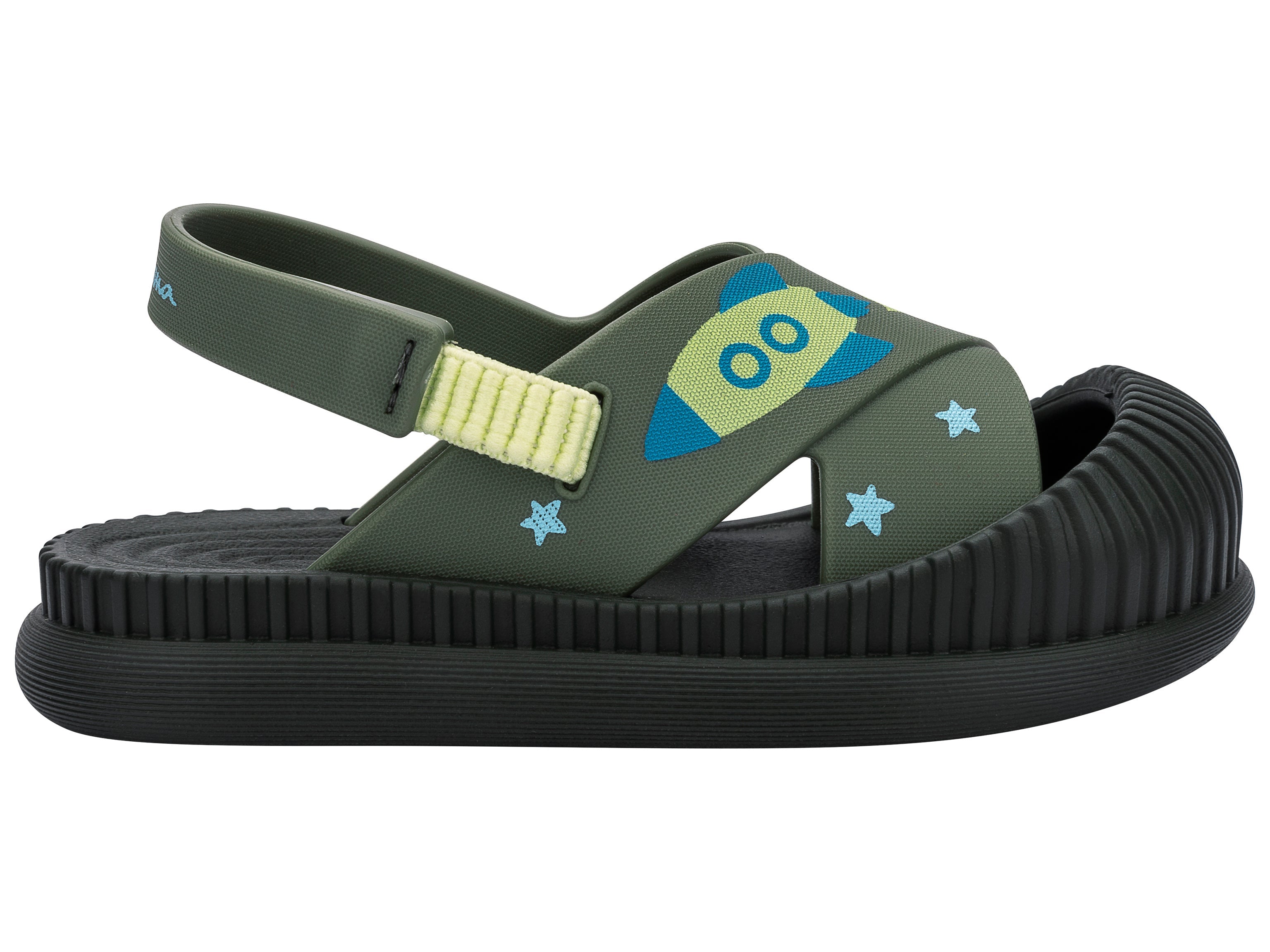 Outer side view of a green Ipanema Cute baby sandal with rocket ship on the strap.