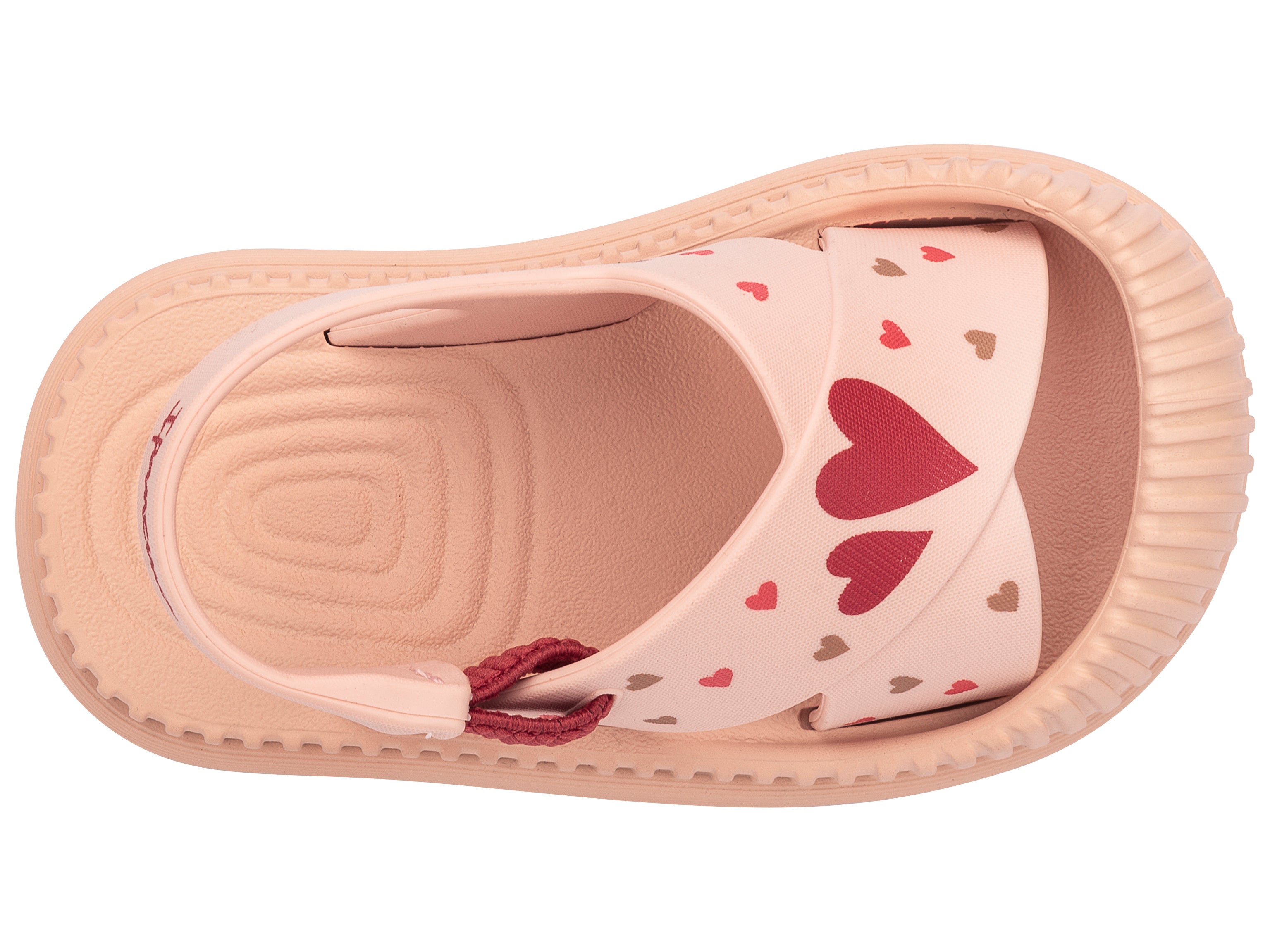 Top view of a beige Ipanema Cute baby sandal with hearts on the strap.