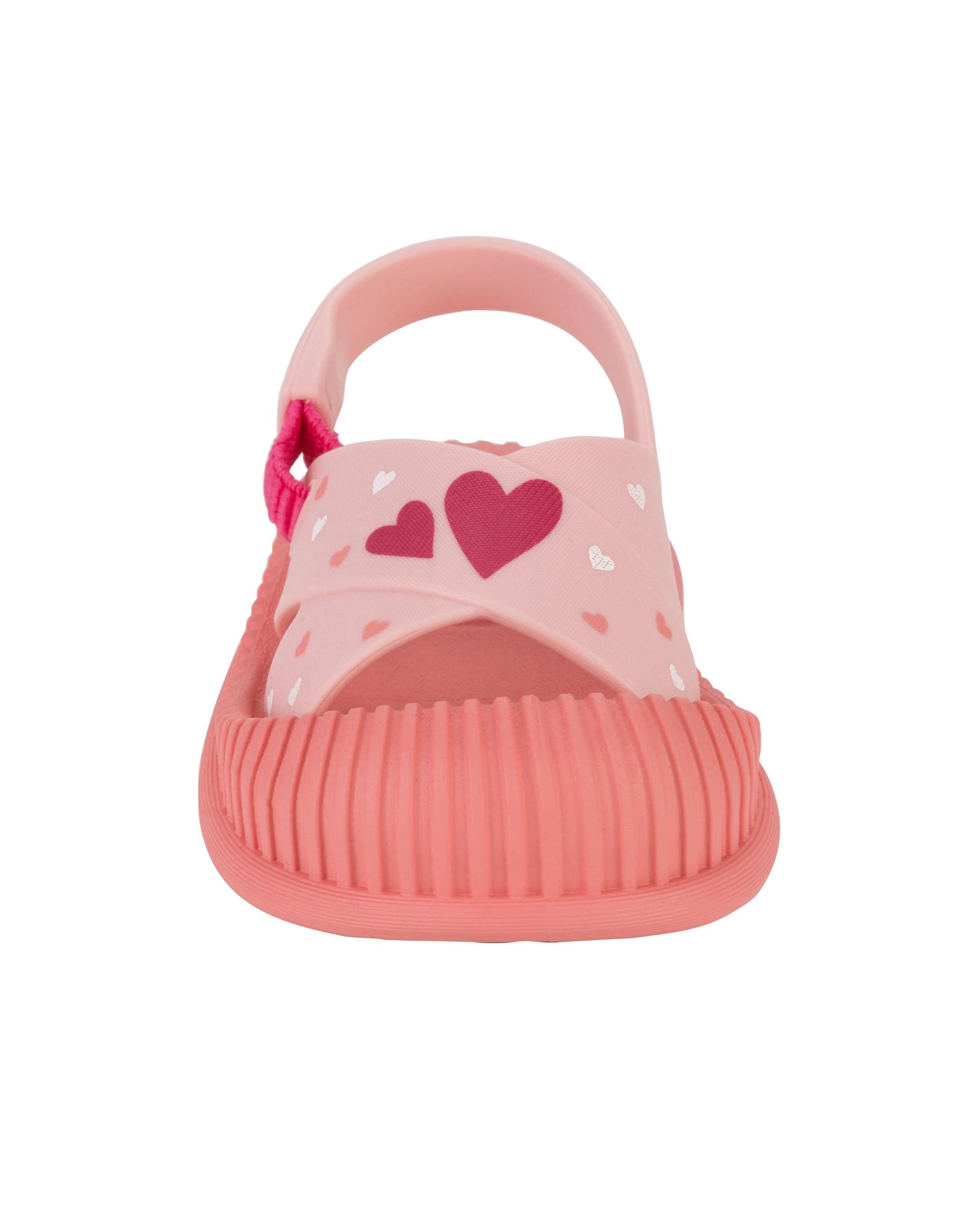 Front view of a pink Ipanema Cute baby sandal with hearts on the strap.