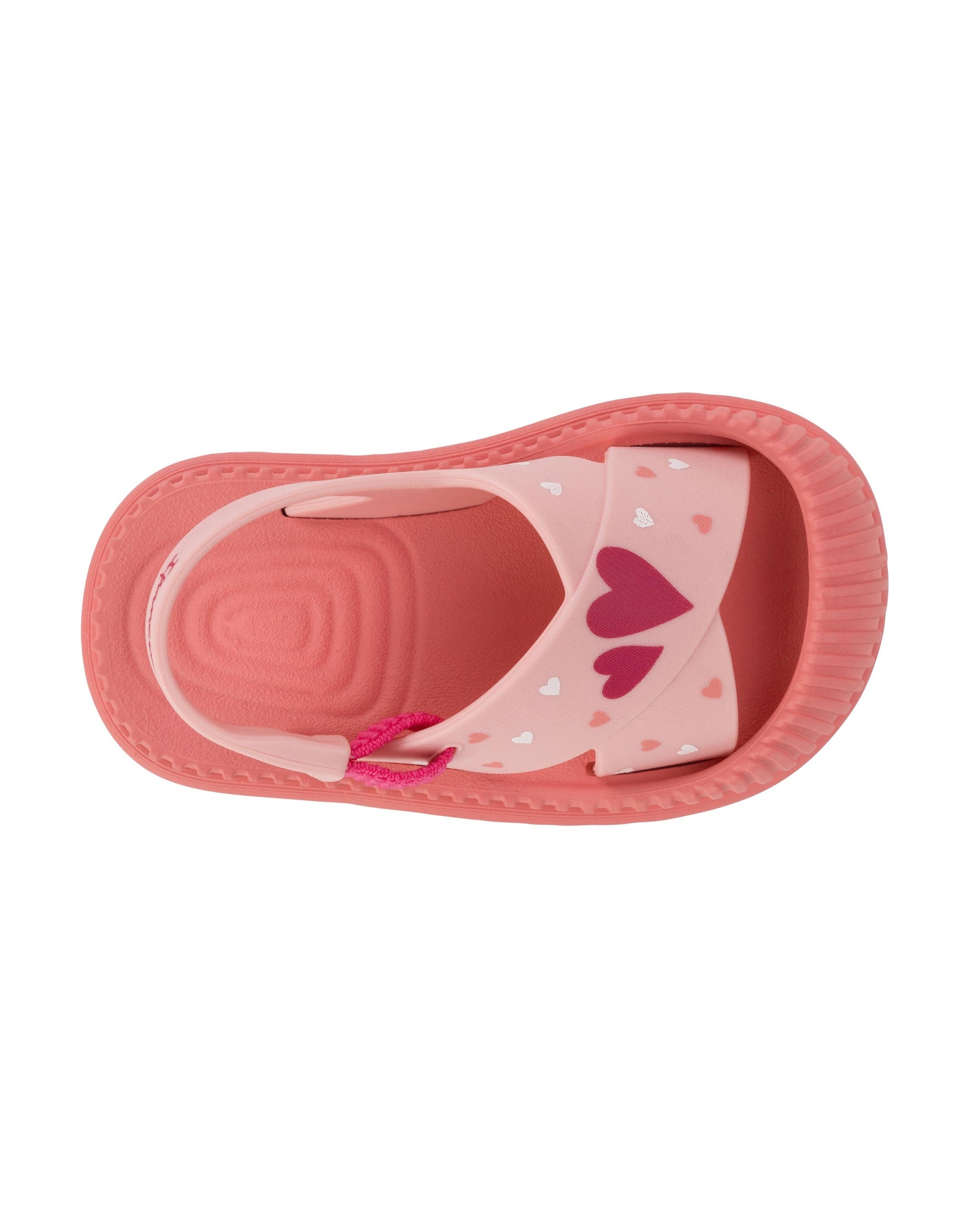 Top view of a pink Ipanema Cute baby sandal with hearts on the strap.