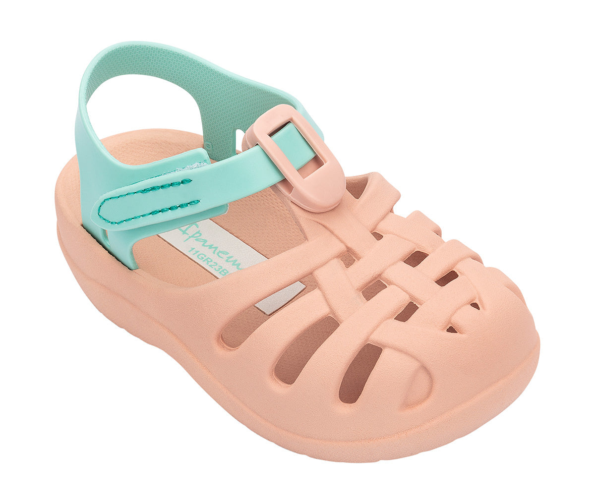 Angled view of a beige Ipanema Summer Basic baby sandal with green strap.