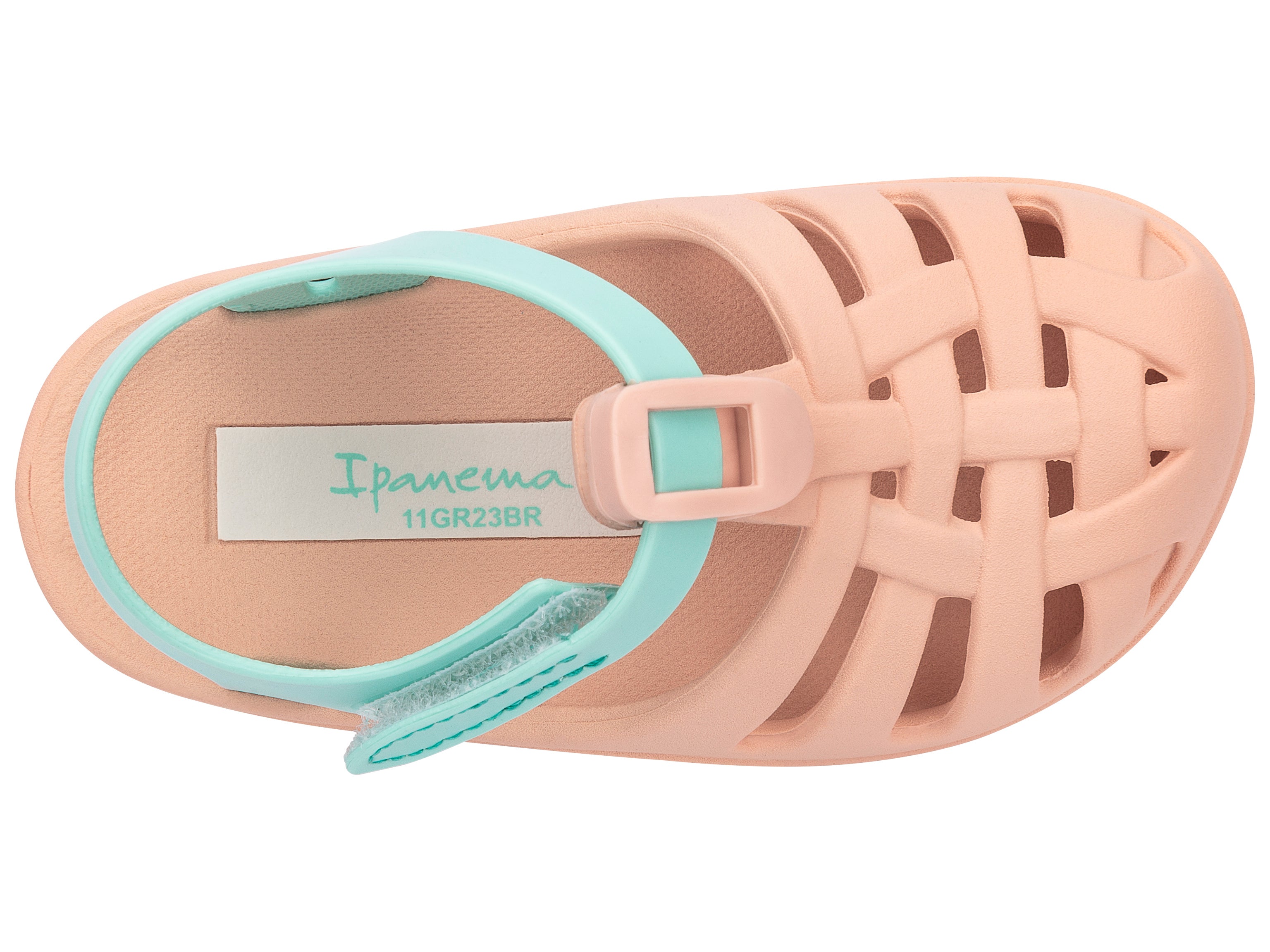 Top view of a beige Ipanema Summer Basic baby sandal with green strap.
