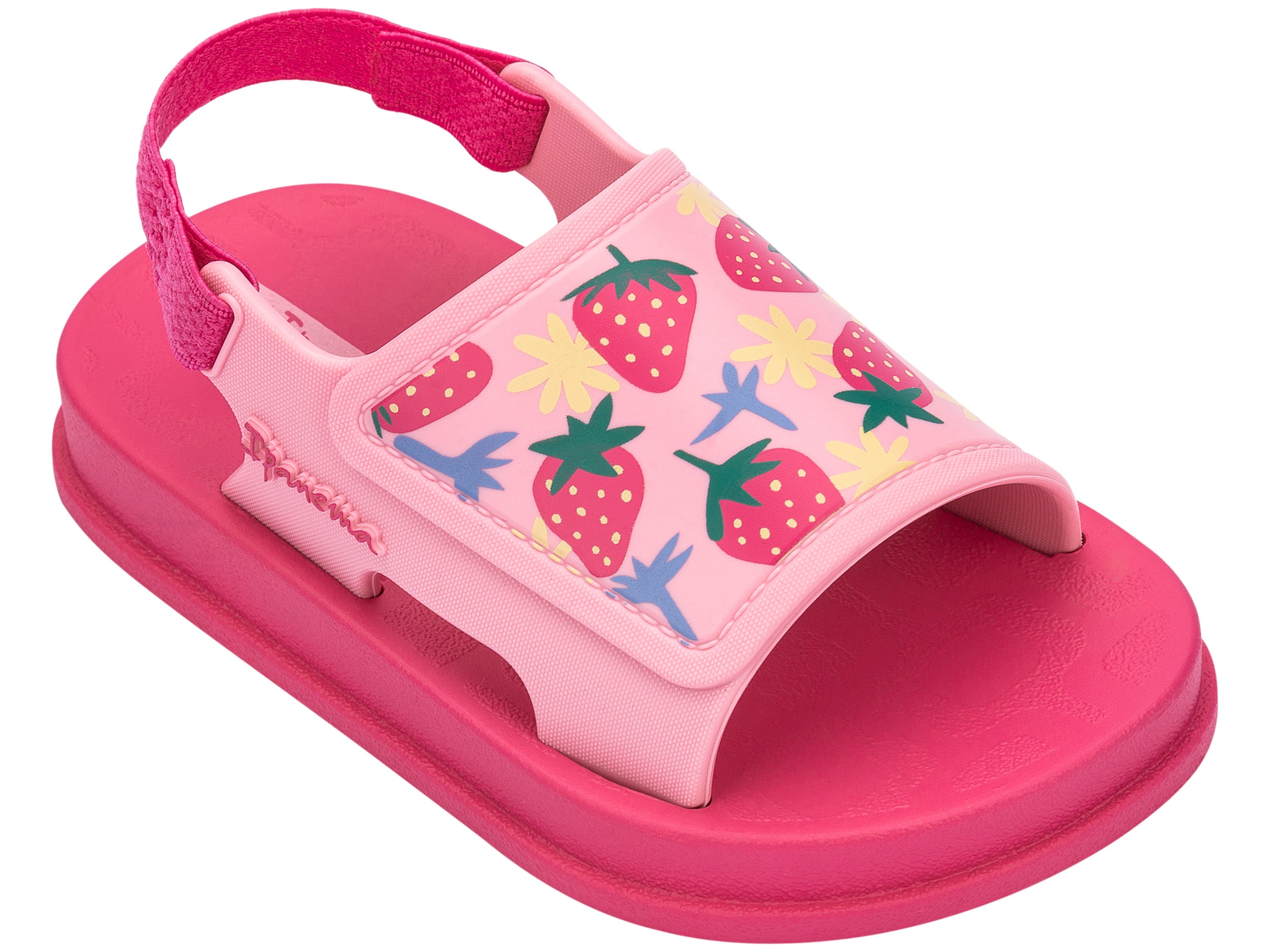 Angled view of a pink Ipanema Soft baby sandal with fruit print on the upper.
