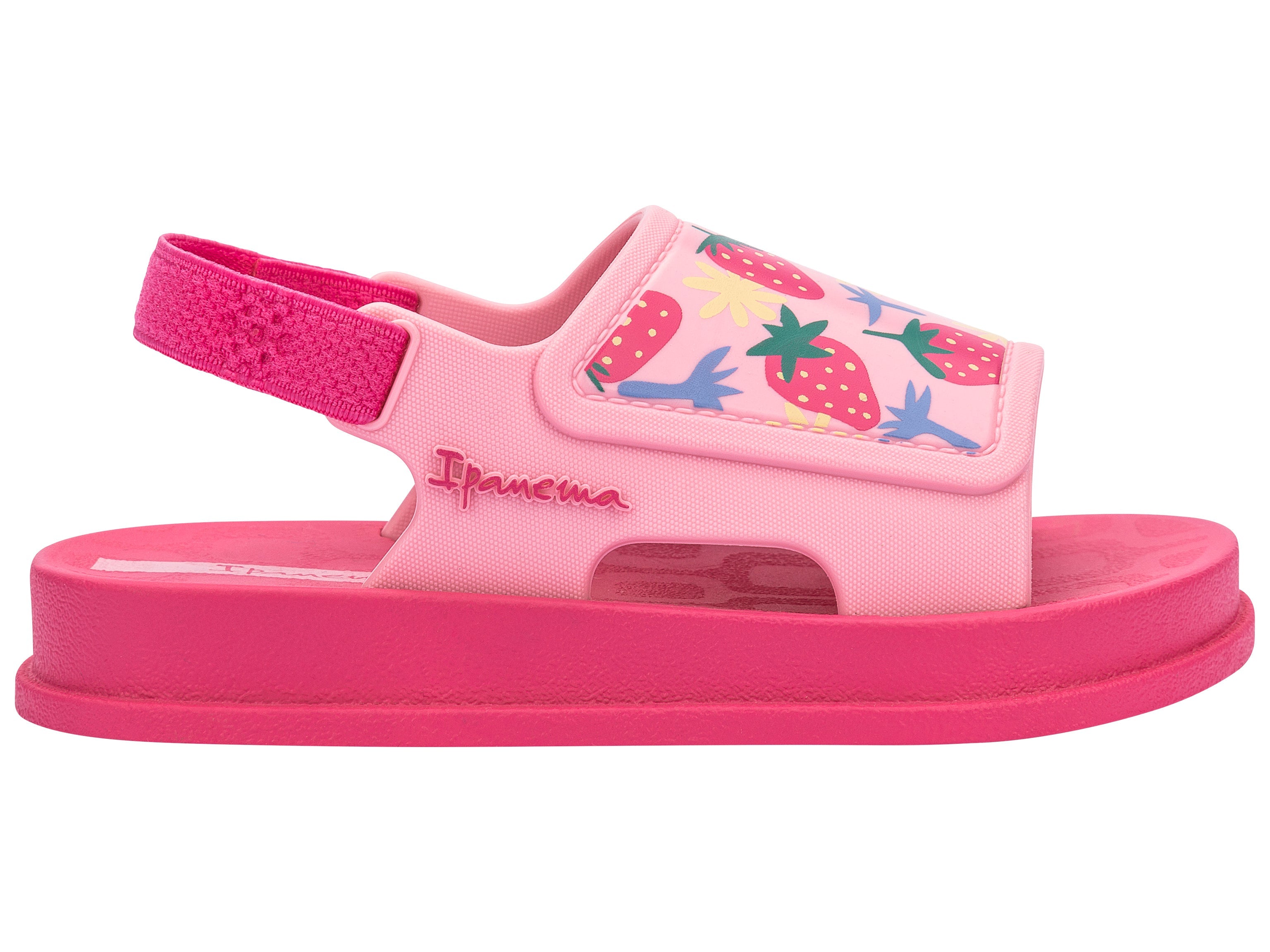 Outer side view of a pink Ipanema Soft baby sandal with fruit print on the upper.