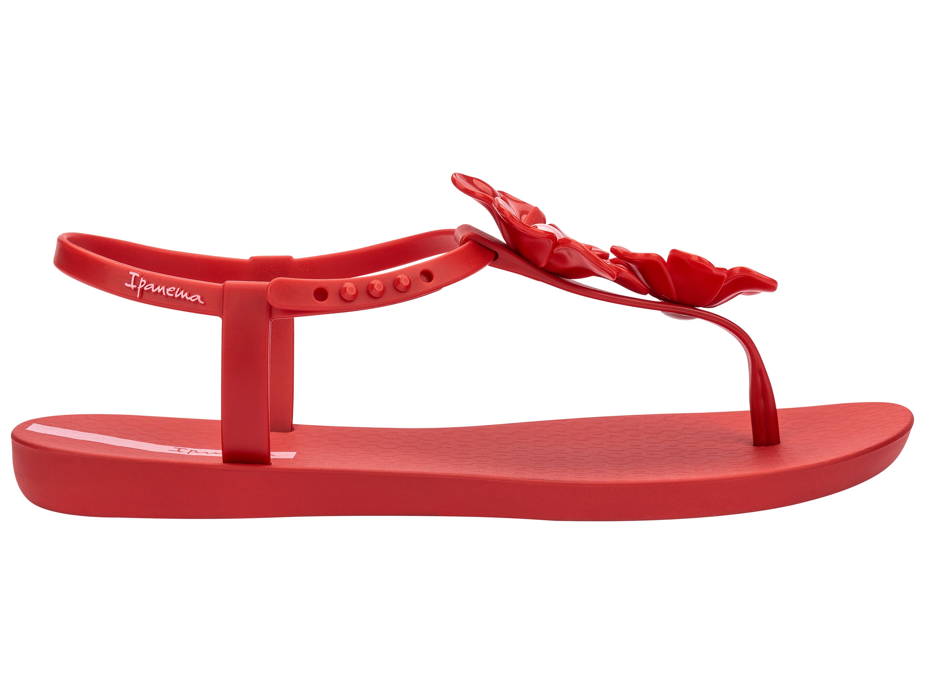 Outer side view of a Red Ipanema Duo Flowers women's t-strap sandal with two flowers.