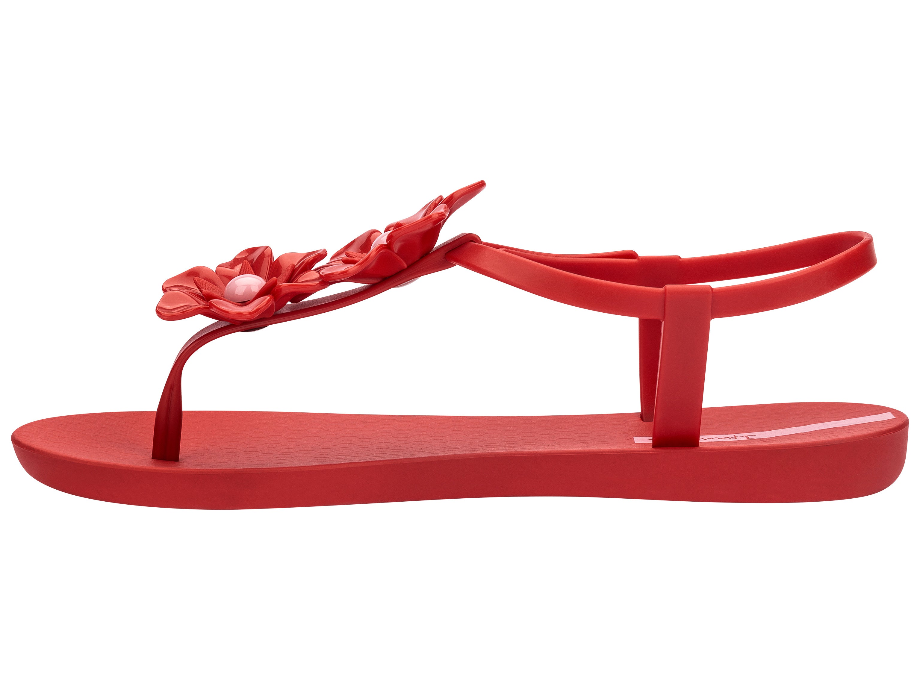 Inner side view of a Red Ipanema Duo Flowers women's t-strap sandal with two flowers.