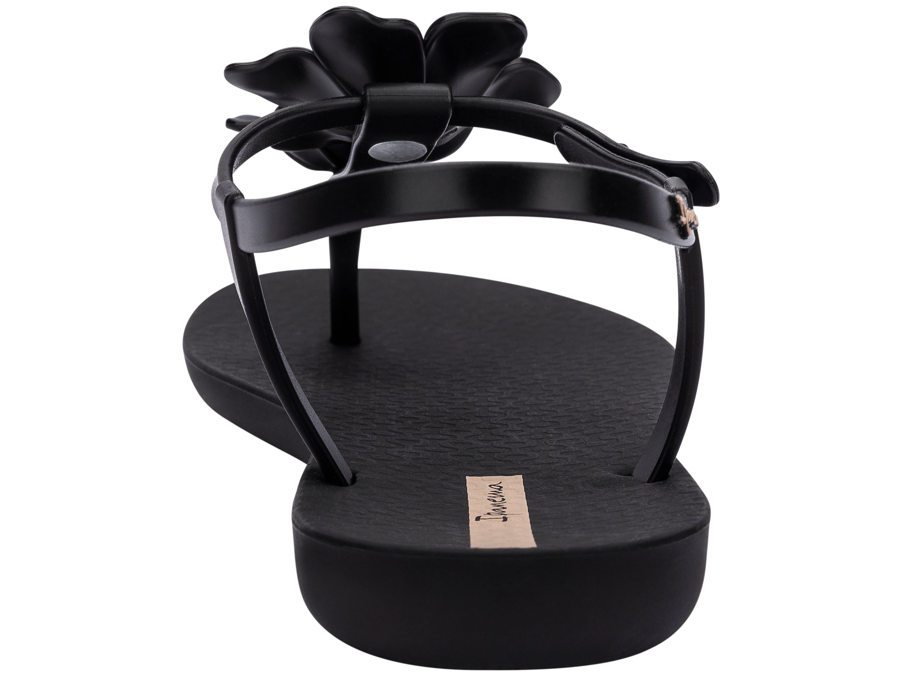 Back view of a black Ipanema Duo Flowers women's t-strap sandal with two flowers.