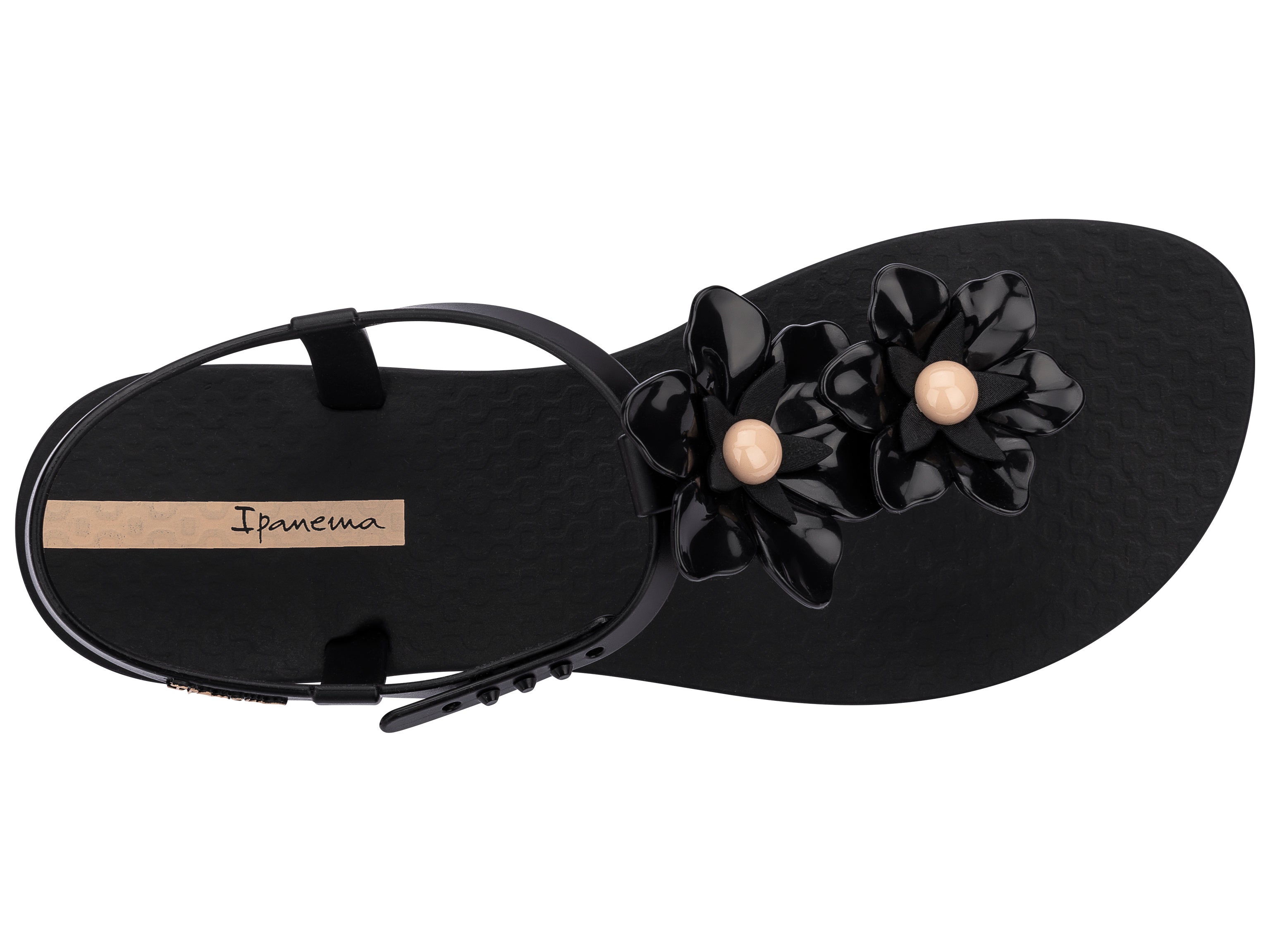 Top view of a black Ipanema Duo Flowers women's t-strap sandal with two flowers.