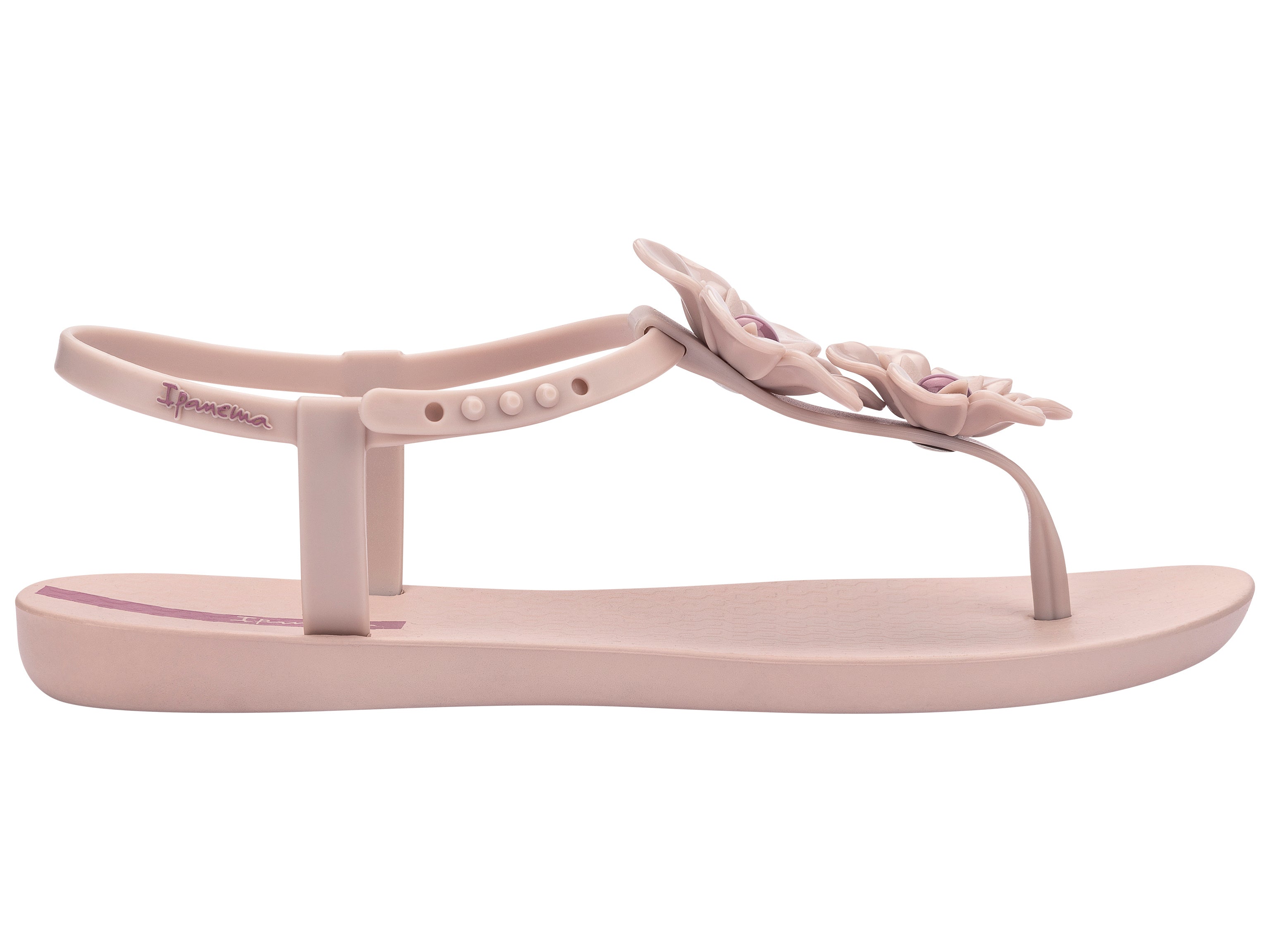 Outer side view of a pink Ipanema Duo Flowers women's t-strap sandal with two flowers.
