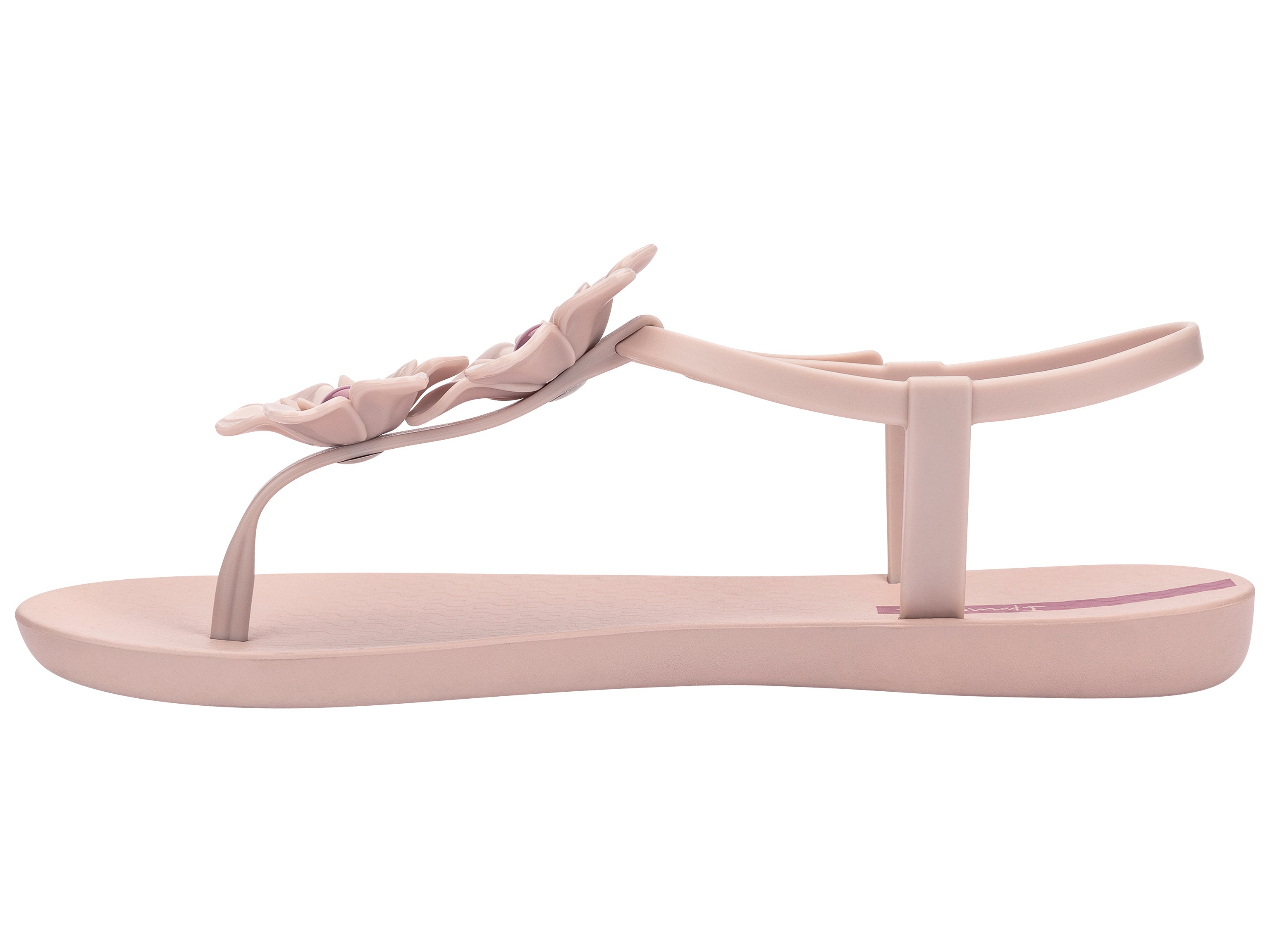 Inner side view of a pink Ipanema Duo Flowers women's t-strap sandal with two flowers.