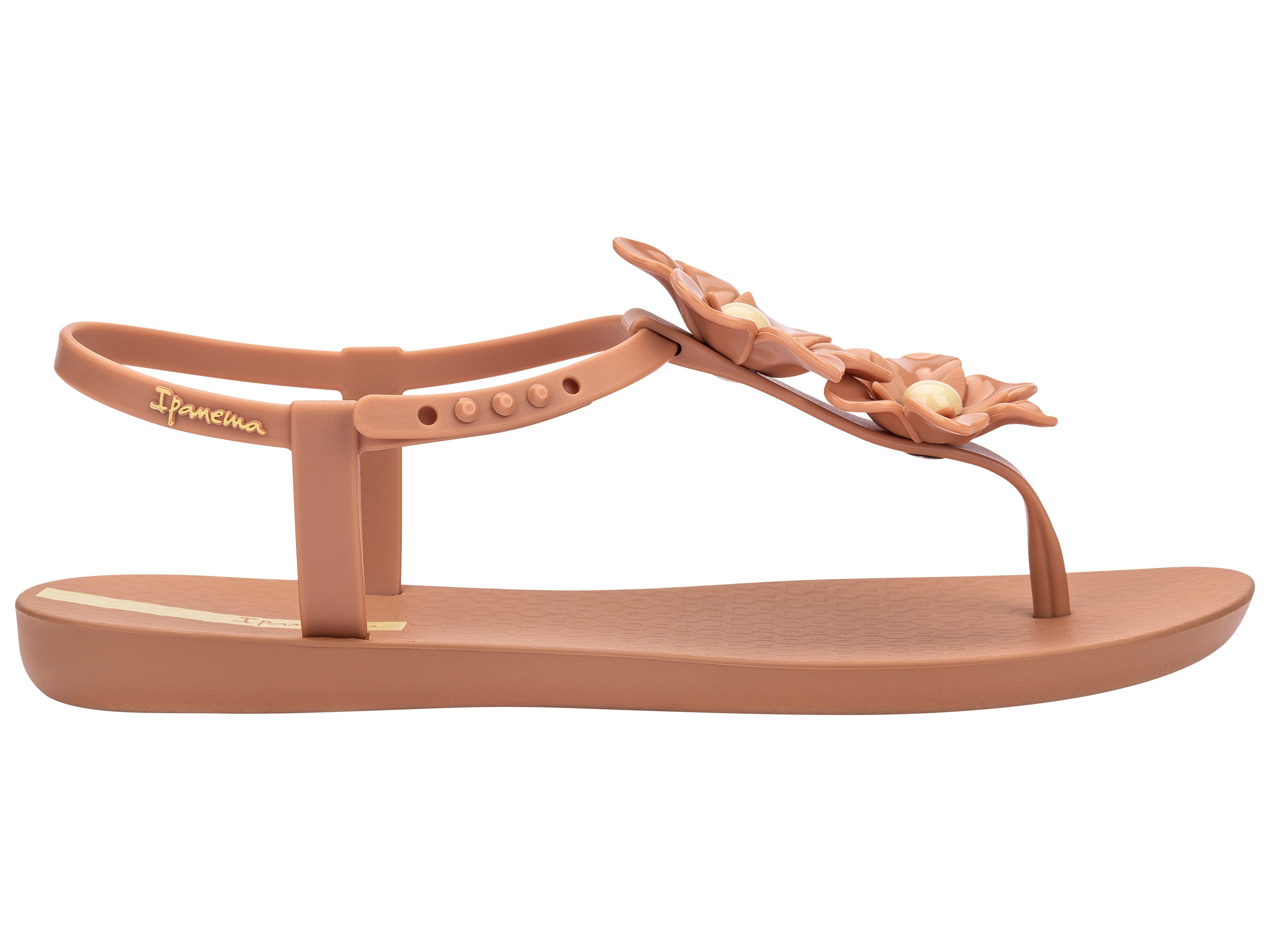 Outer side view of a brown Ipanema Duo Flowers women's t-strap sandal with two flowers.