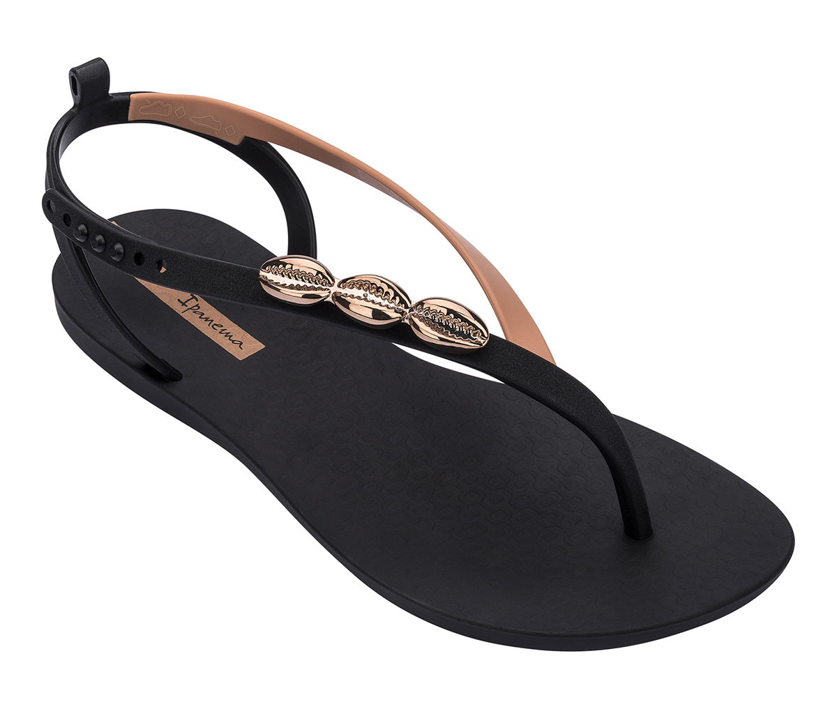 Angled view of a black Ipanema Salty women's sandal with 3 gold shells on the strap.