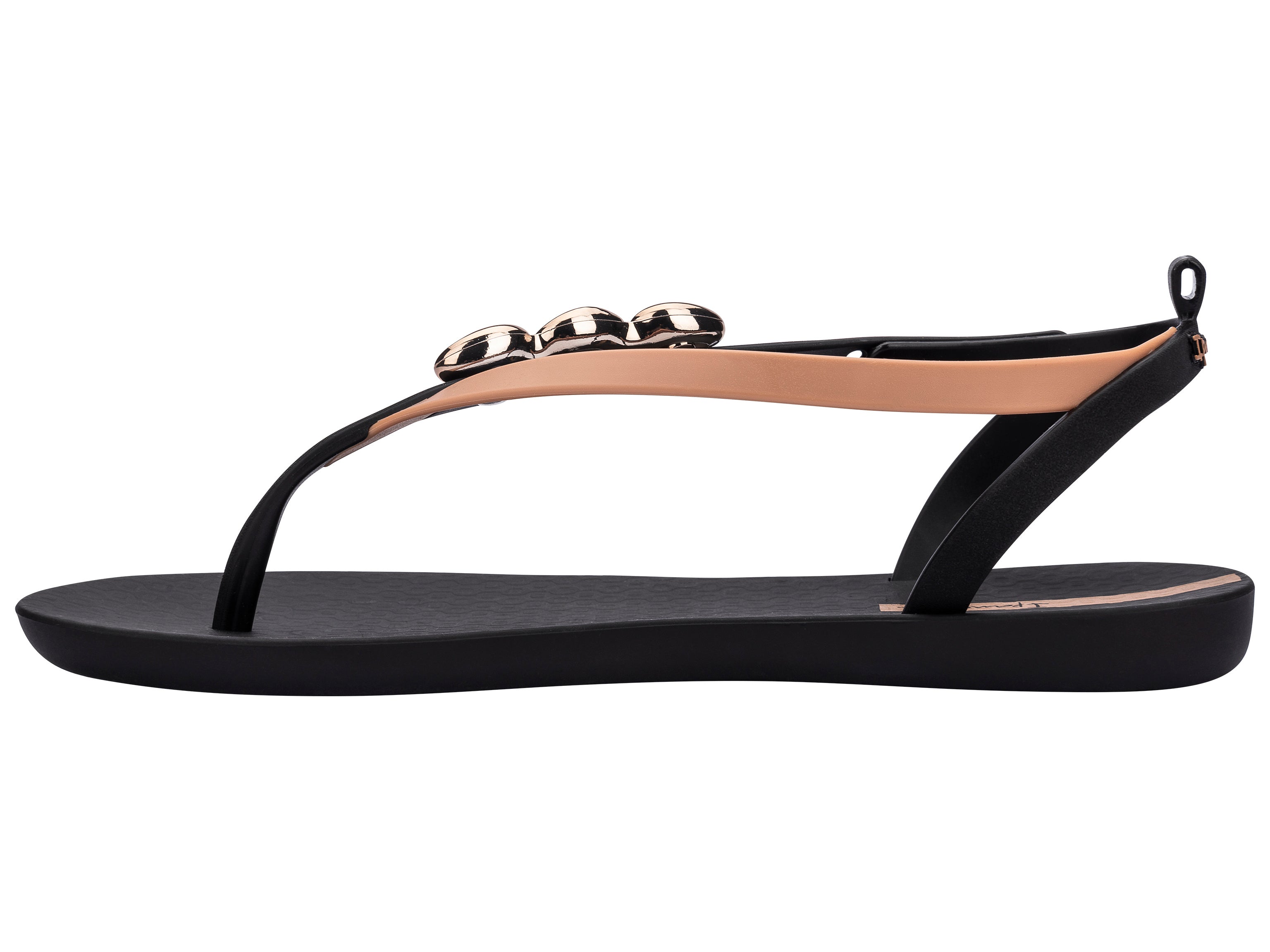 Inner side view of a black Ipanema Salty women's sandal with 3 gold shells on the strap.