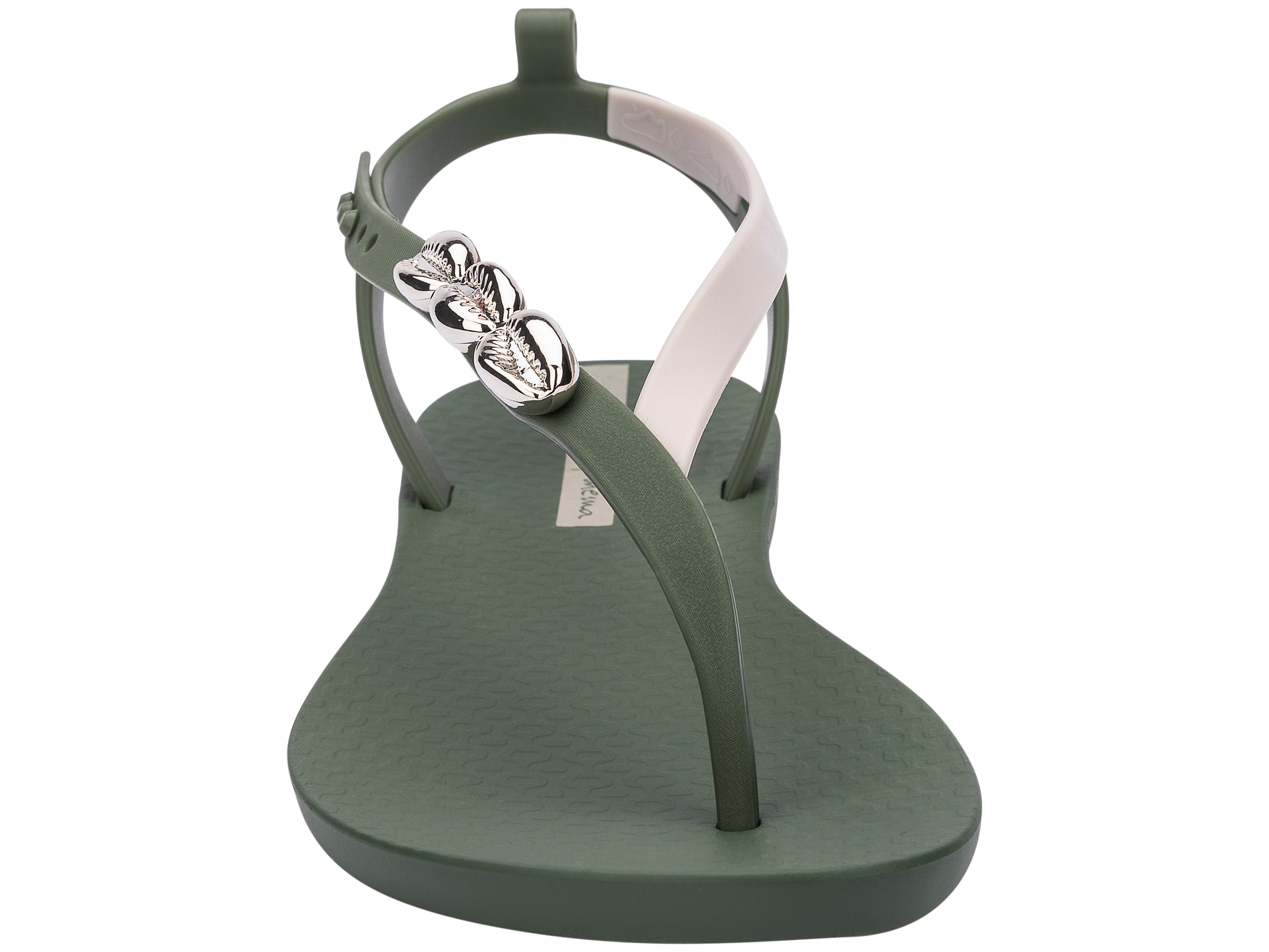 Front view of a green Ipanema Salty women's sandal with 3 silver shells on the strap.
