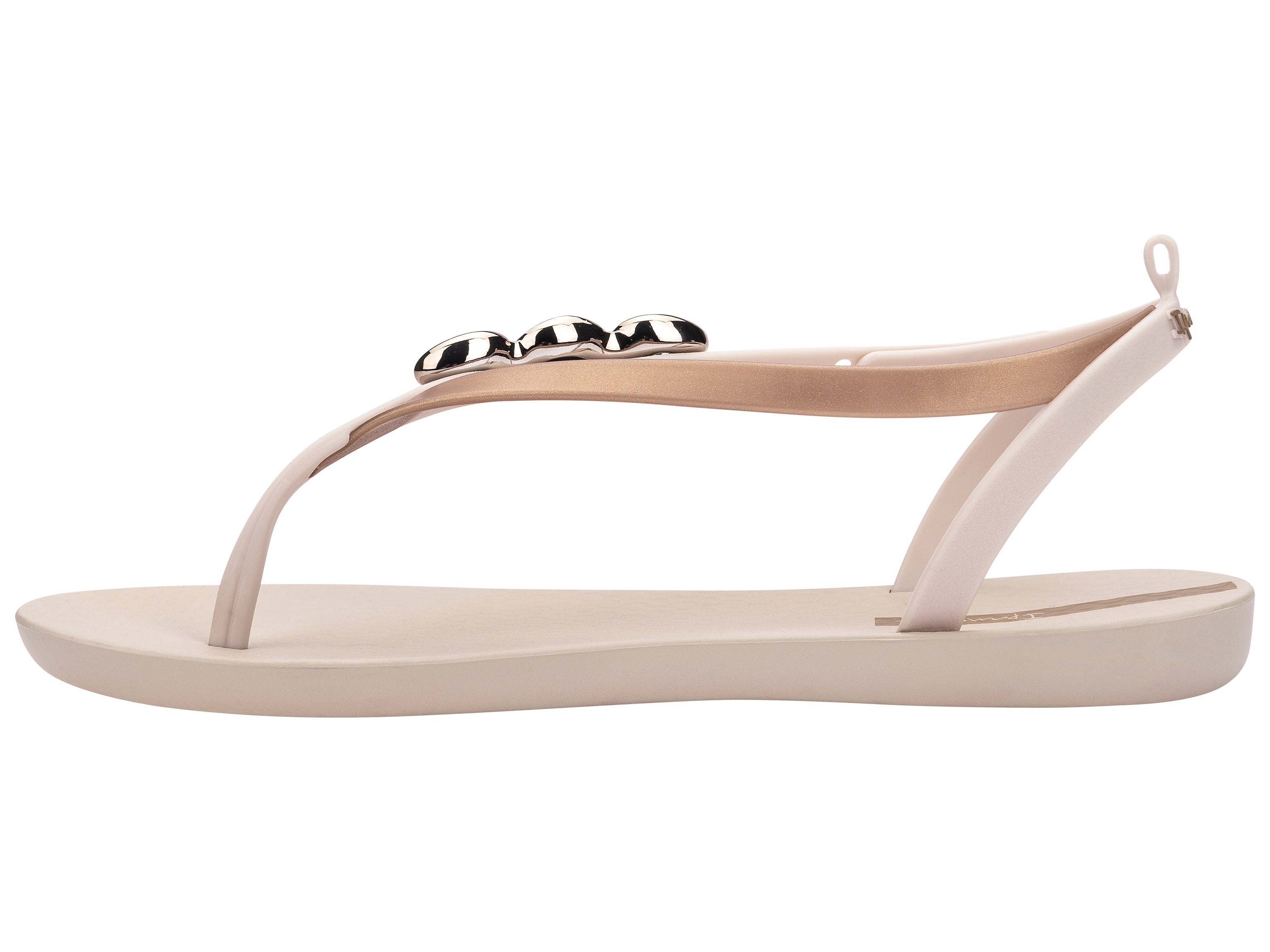 Inner side view of a beige Ipanema Salty women's sandal with 3 gold shells on the strap.