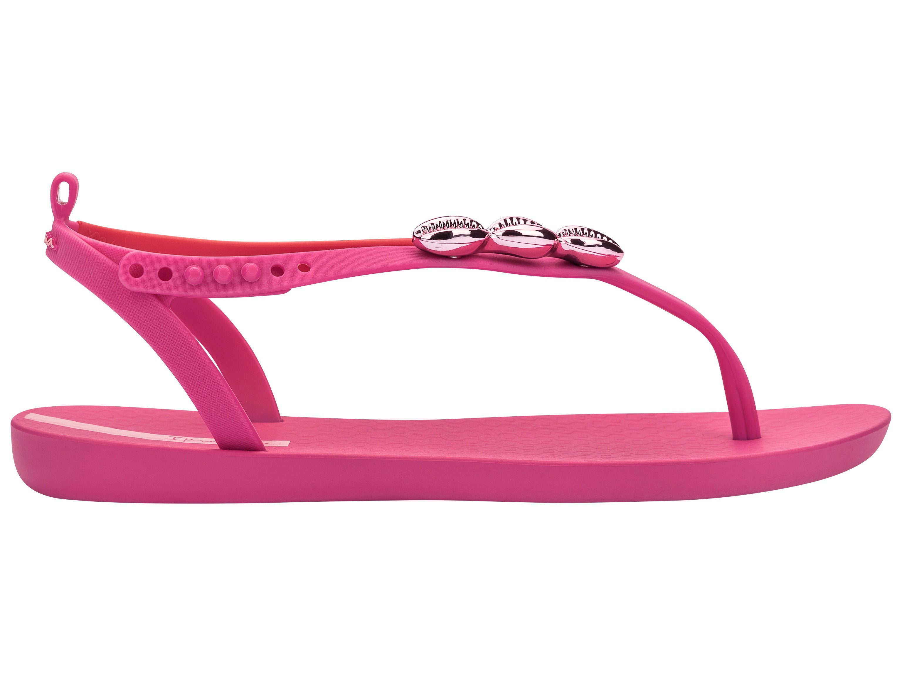 Outer side view of a pink Ipanema Salty women's sandal with 3 pink metallic shells on the strap.