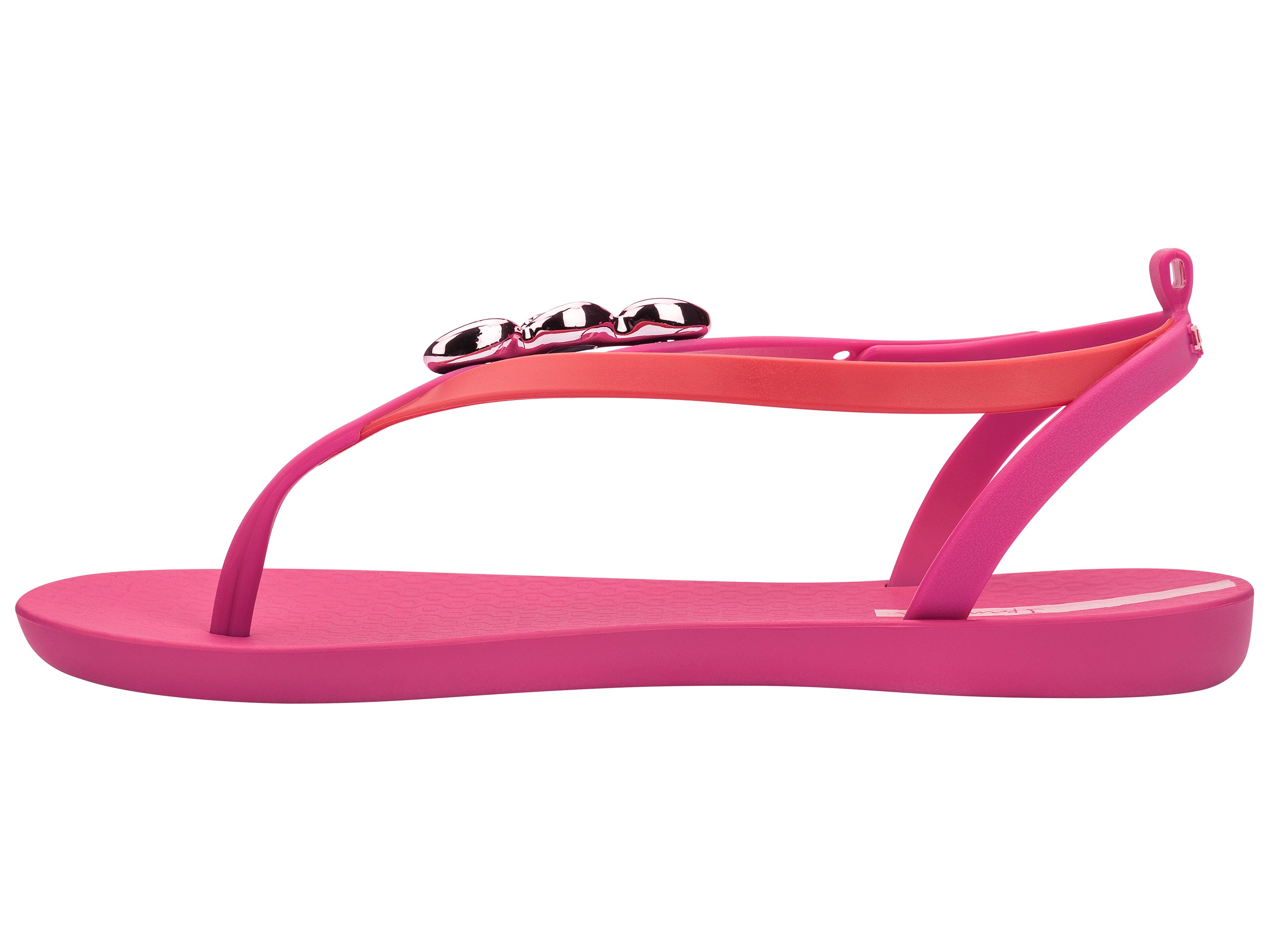 Inner side view of a pink Ipanema Salty women's sandal with 3 pink metallic shells on the strap.