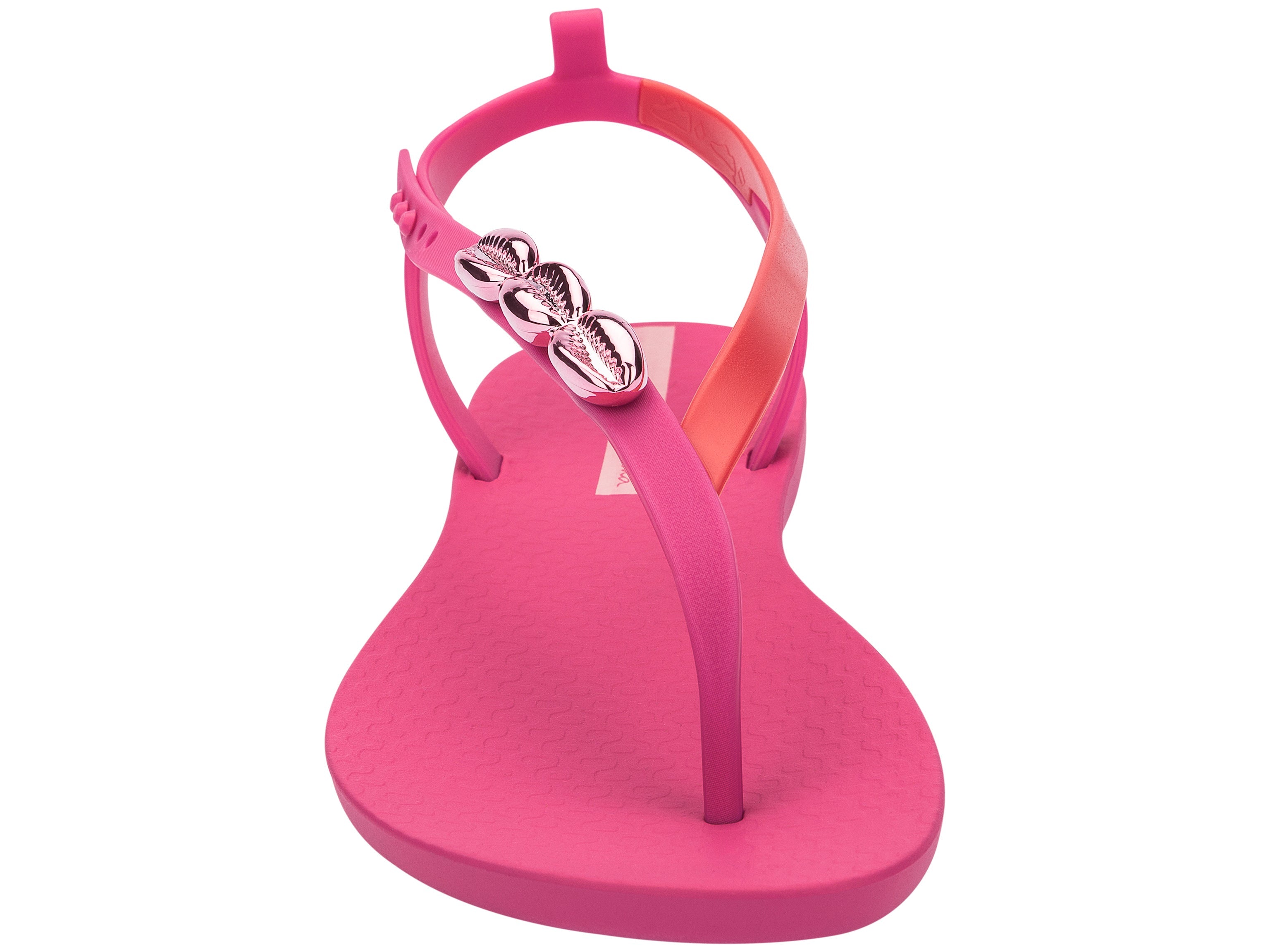 Front view of a pink Ipanema Salty women's sandal with 3 pink metallic shells on the strap.
