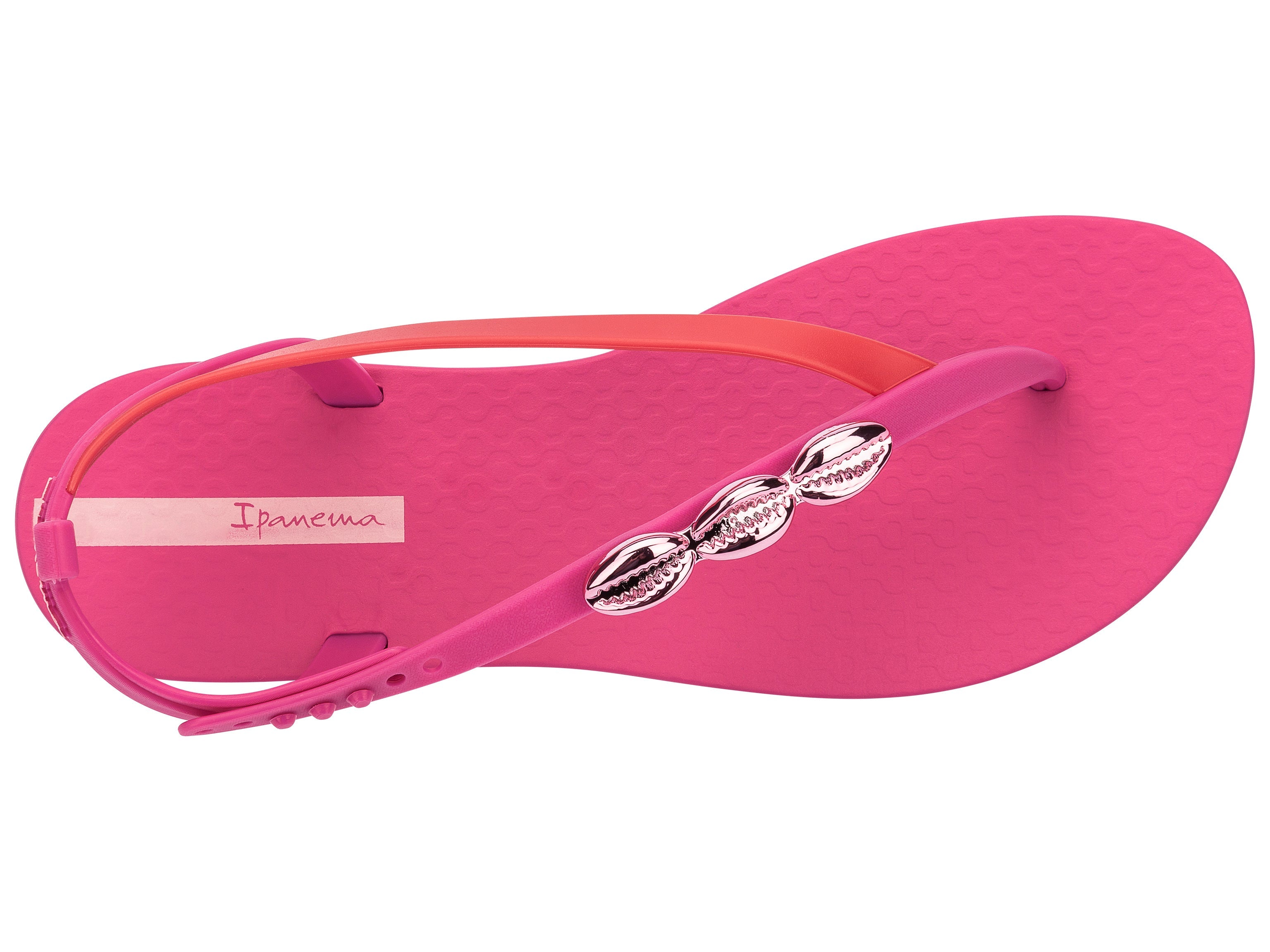 Top view of a pink Ipanema Salty women's sandal with 3 pink metallic shells on the strap.