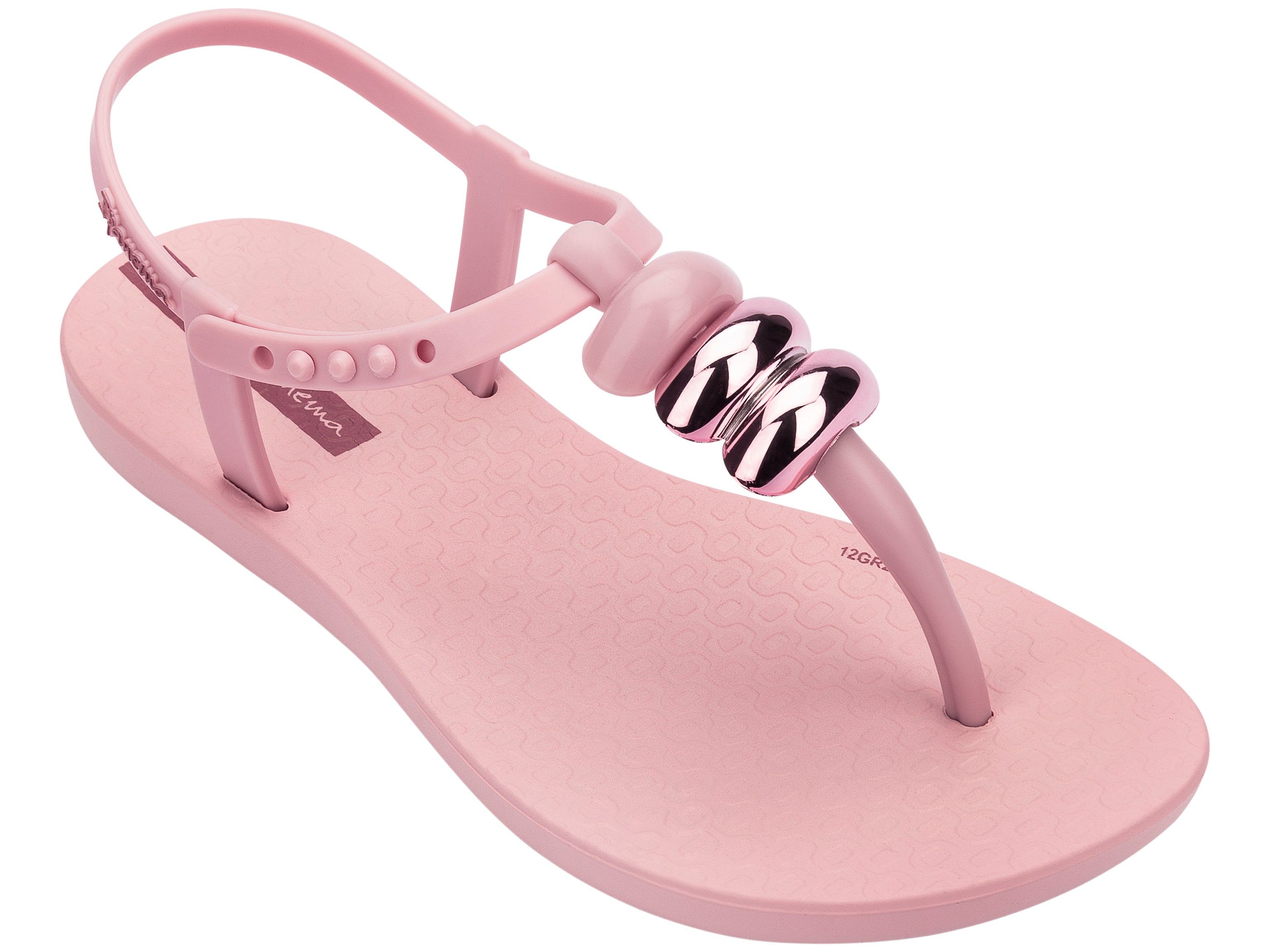 Angled view of a light pink Ipanema Class kids' t-strap sandal with 3 baubles on the strap.