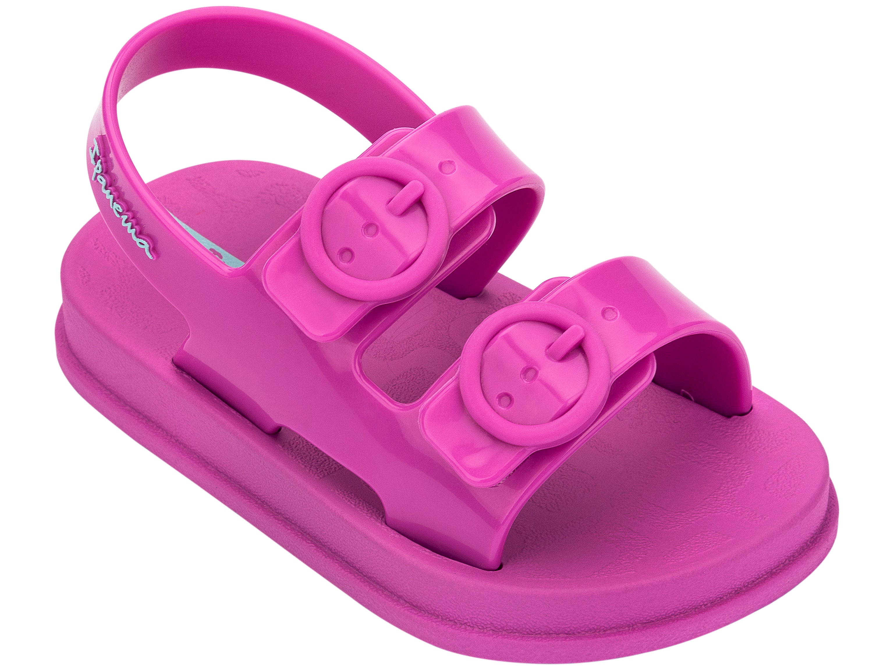 Angled view of a pink Ipanema Follow baby sandal with two decorative buckles on the upper.