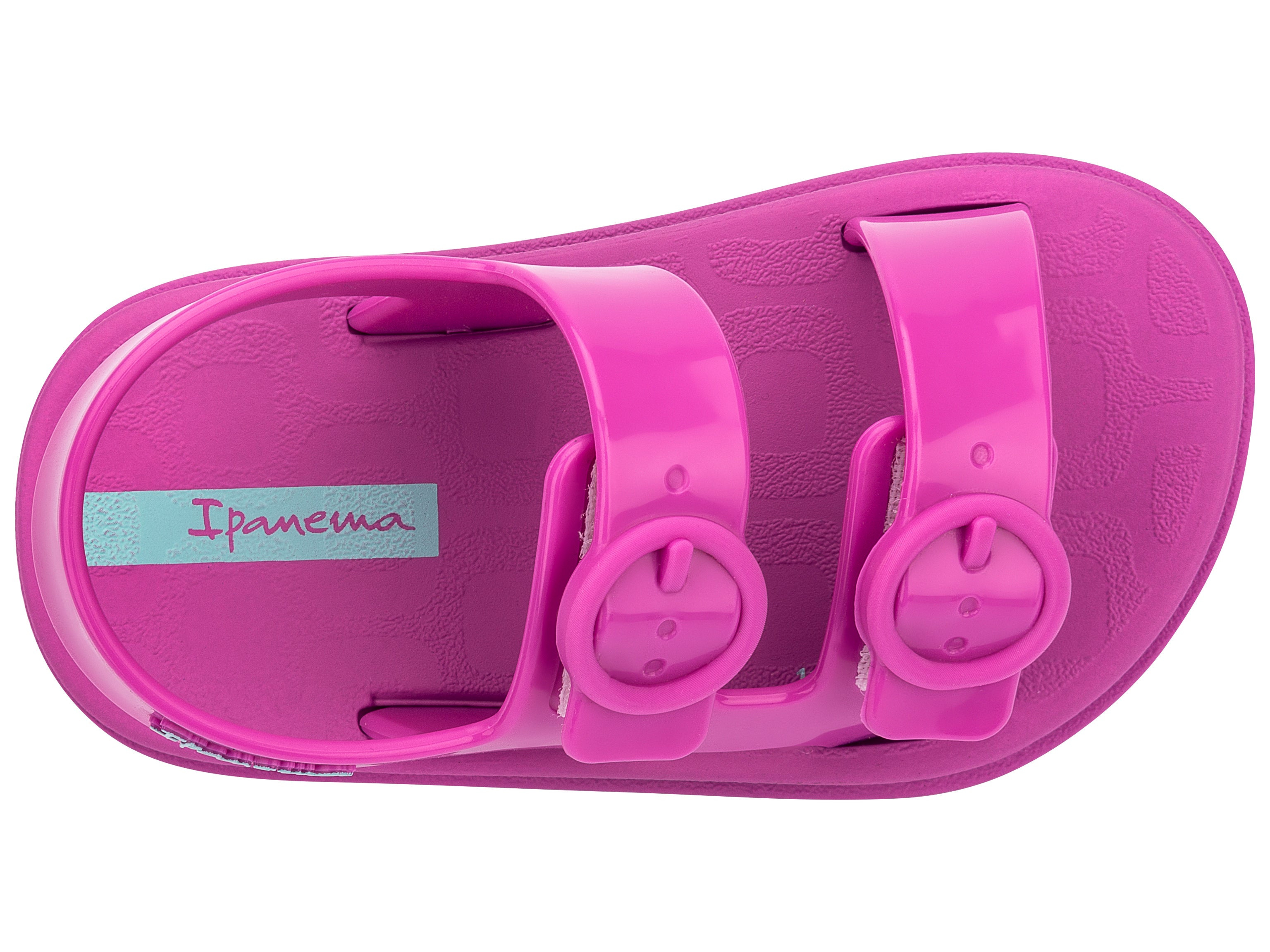 Top view of a pink Ipanema Follow baby sandal with two decorative buckles on the upper.
