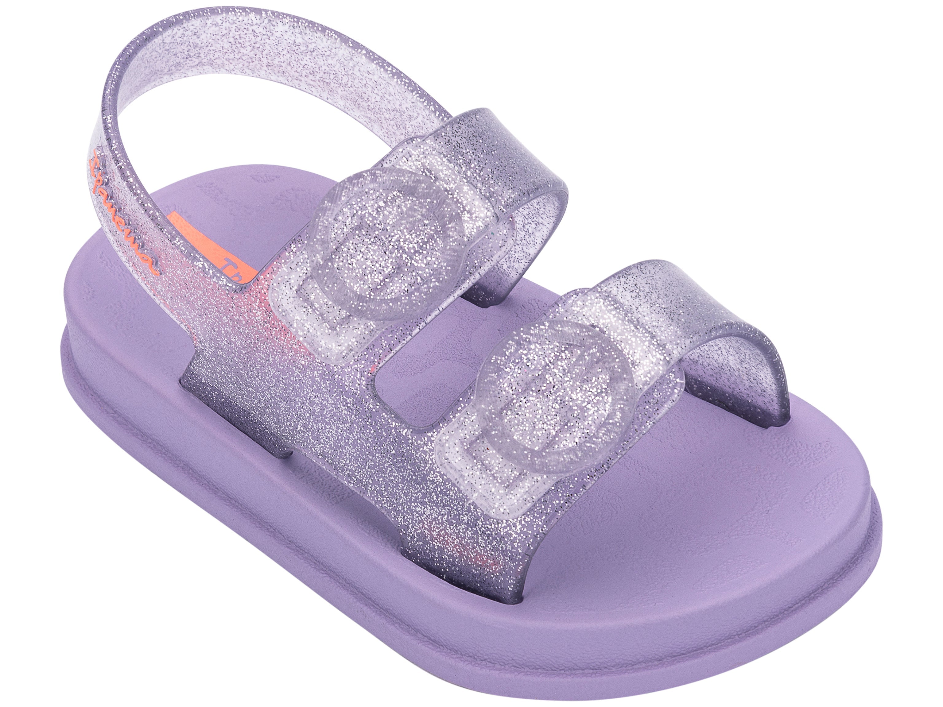 Angled view of a purple Ipanema Follow baby sandal with two decorative buckles on the upper.