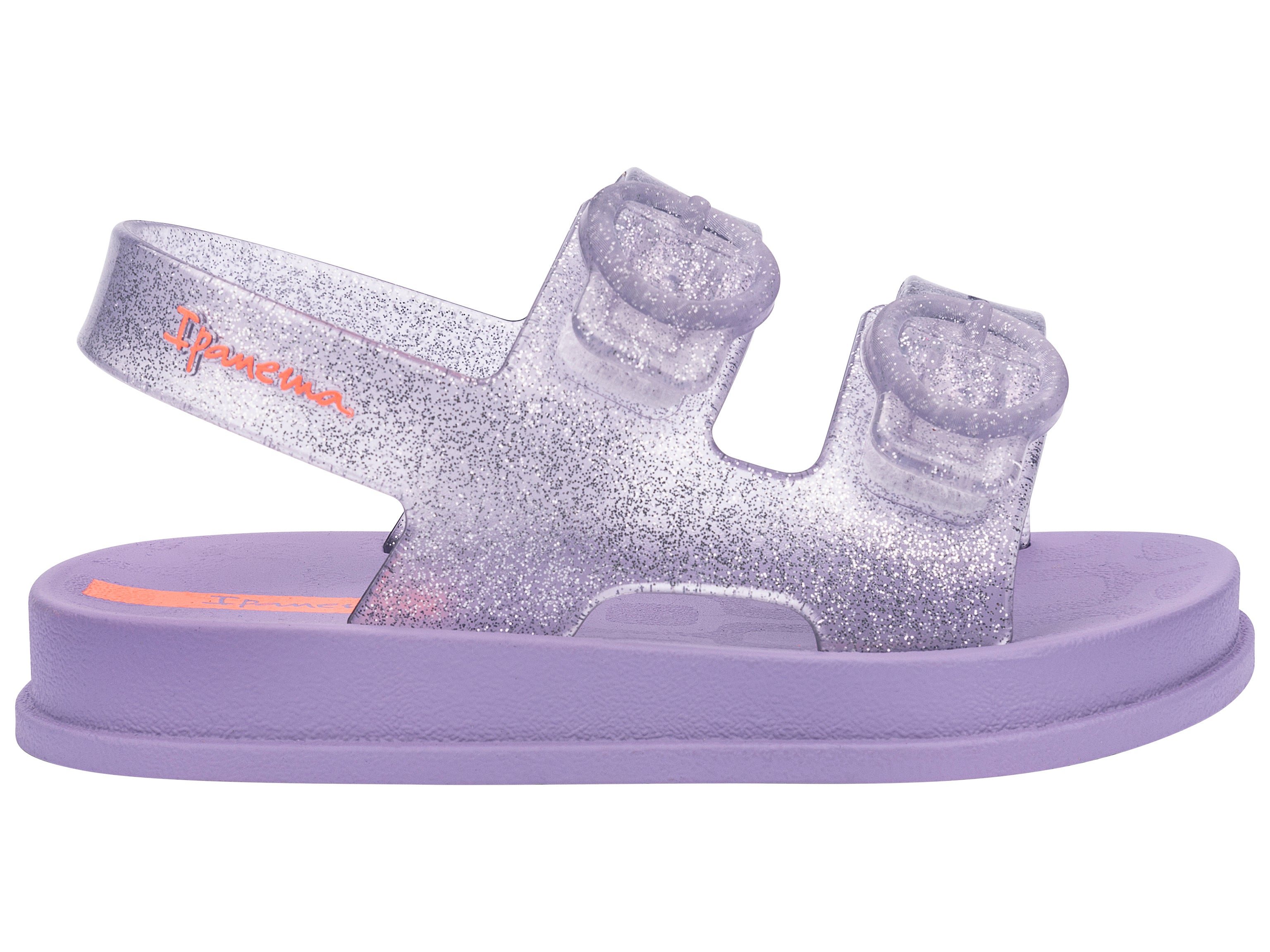 Outer side view of a purple Ipanema Follow baby sandal with two decorative buckles on the upper.